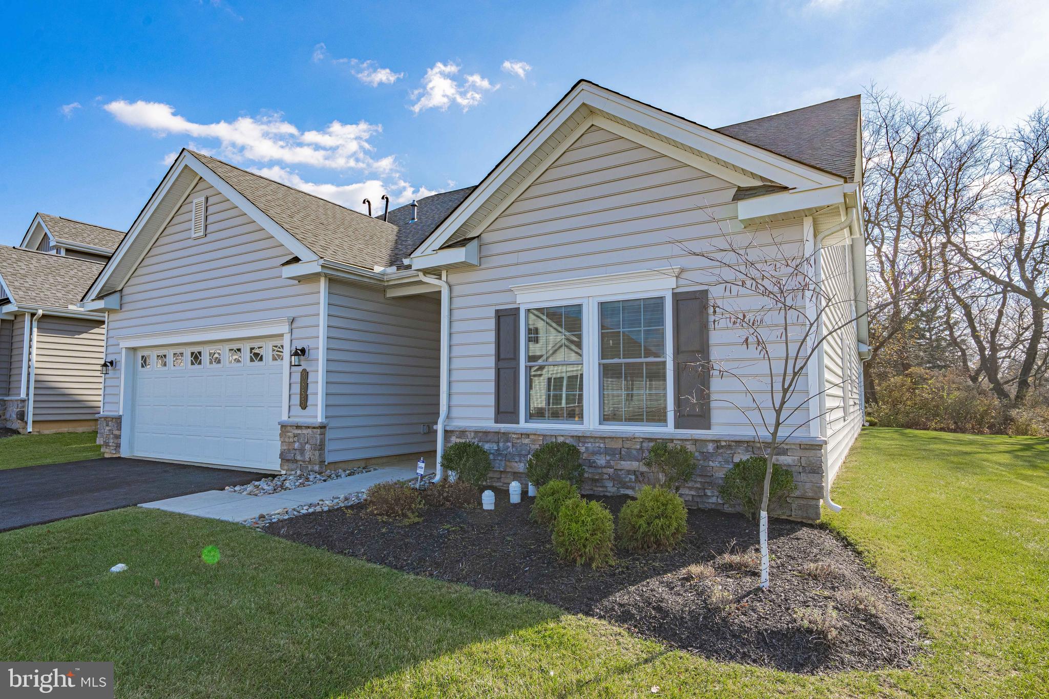 Welcome to 3855 Victors Way, a stunning 3-bedroom, 3.5-bathroom home in one of the most sought-after 55+ communities in the Lehigh Valley. This home perfectly blends luxury, comfort, and low-maintenance living. Step inside to a bright, open-concept living space with soaring ceilings and oversized windows that flood every room with natural light. The spacious, modern kitchen features stainless steel appliances, granite countertops, a large center island, and custom cabinetry. The primary suite is your private retreat, complete with a walk-in closet and spa-like en-suite bathroom featuring dual vanities and a glass-enclosed shower. Guests will enjoy their own private en-suite in the second bedroom, while the versatile third bedroom is ideal as an additional guest room, library, or hobby room. Every detail of this home is thoughtfully designed to be both stylish and functional. Enjoy resort-style amenities just steps from your door: Clubhouse with fitness center, golf simulator, a theater room, an outdoor pool & spa, pickleball & tennis courts. This low-maintenance lifestyle includes lawn care and snow removal, so you can spend your time enjoying what matters most. Located in picturesque Easton, PA, Traditions of America at Green Pond offers easy access to shopping, dining, golf courses, and entertainment, making it the perfect location to live life to the fullest. Don’t miss your chance to call this exquisite home your own. Schedule your showing today!