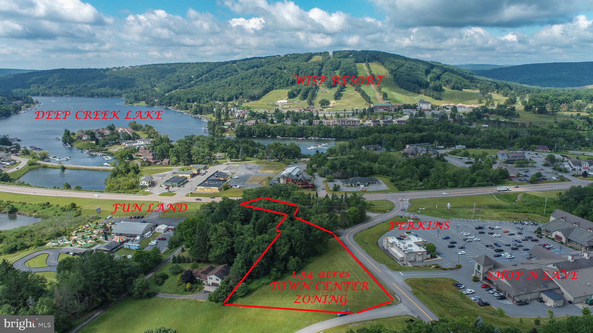 Rare opportunity to own a town center zoned lot with 1.54 acres in the heart of McHenry at Deep Creek Lake! This property sits adjacent to the Bear Creek Traders Plaza which includes Shop N Save, Perkins and more. Western exposure looking directly over Wisp Resort and filtered views of Deep Creek Lake provide a fantastic opportunity for views. Town Center zoning allows for mixed use commercial and/or residential use.  The zoning ordinance will allow for up to 8 townhouse units. Many other opportunities on this excellent property. Call today for more information or to schedule a private showing!