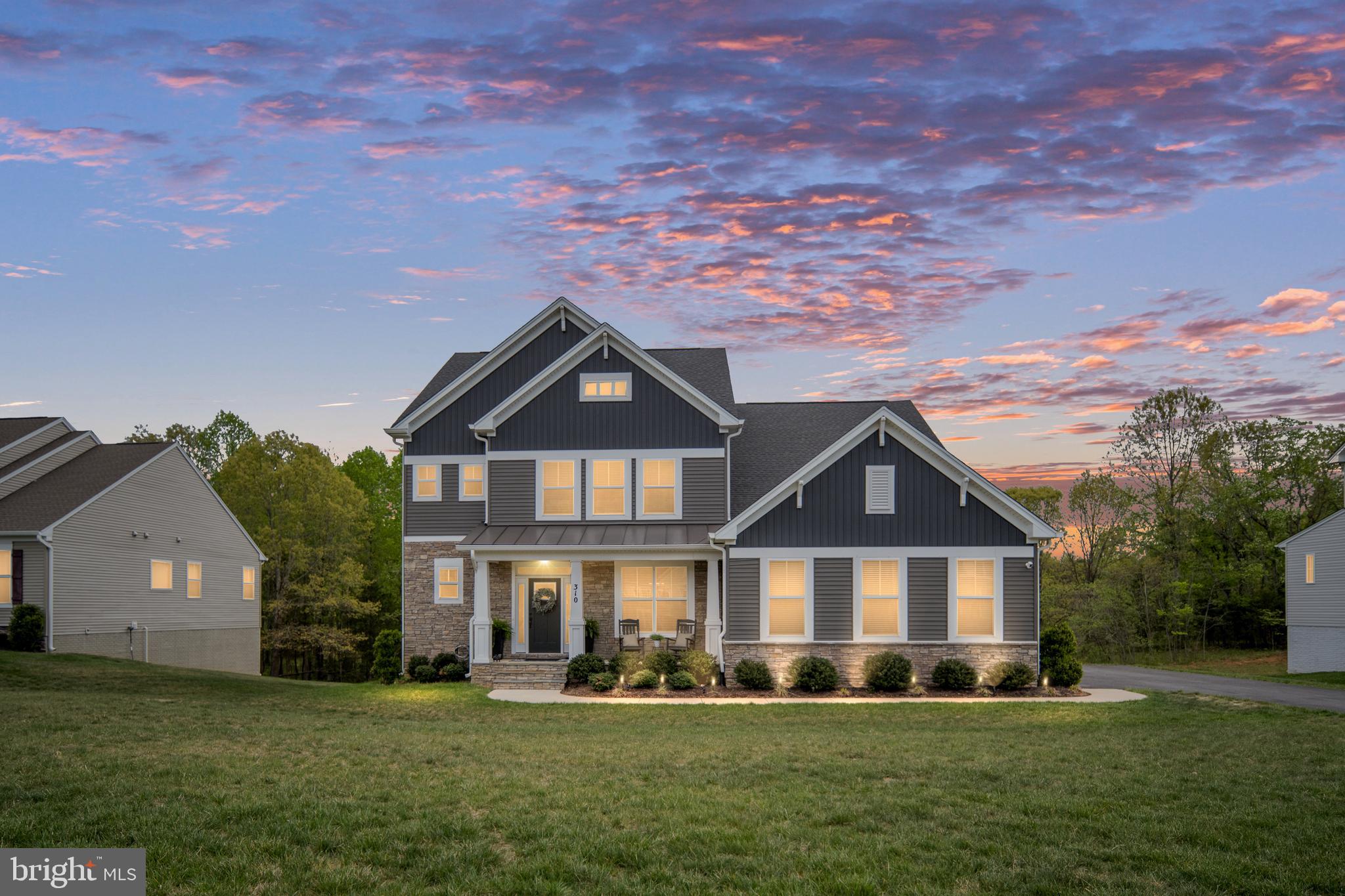 Back on market no fault of the sellers and prime opportunity for you to make a move. Welcome to the perfect blend of modern design, space, and lifestyle in the highly sought-after Liberty Hall community in Stafford, VA. Built in 2022 by Atlantic Builders and set on a private 1.5-acre homesite, this beautifully upgraded home offers the space you’ve been looking for—inside and out—while still being conveniently located to everything Stafford has to offer.

From the moment you arrive, the stone-front exterior and oversized two-car garage with keypad entry create a strong first impression. Inside, the home opens to a light-filled, thoughtfully designed floor plan built for the way people live today. The heart of the home is the stunning gourmet kitchen, featuring a quartz top island with an additional second custom quartz island with added storage, soft-close cabinetry, and a full walk-in pantry that keeps everything organized and within reach. Just off the kitchen, a pocket office provides the perfect work-from-home setup without sacrificing space.

The main living area is warm and inviting, centered around a gas fireplace and an abundance of windows capturing the natural lighting and a scenic view. The morning room adds even more natural light, complete with a ceiling fan and sliding glass door that leads to your outdoor living space. Step outside to the composite deck featuring a built-in bar top, grill bump-out, and lighted stairs—ideal for entertaining or simply unwinding at the end of the day.

Out back, your private retreat continues with a walkout basement leading to a patio and a Hot Springs Grandee saltwater hot tub (2023), designed to comfortably seat up to seven. Whether hosting friends or enjoying quiet evenings under the stars, this space delivers. Enjoy entertaining this summer on your 26 x 12 Trex deck with bar top, and additional grill bump out. 

Upstairs, the primary suite is a true escape, offering two walk-in closets, a massive walk-in shower, and dual vanities with quartz countertops—including a separate additional vanity space for added convenience. One secondary bedroom features a private en-suite, with its own walk-in closet, while the remaining bedrooms share a Jack-and-Jill bathroom with a double vanity also with quartz countertops, providing both functionality and privacy.

The finished walkout basement adds even more versatility, complete with a bedroom and full bathroom, plus an additional room that can easily serve as a guest space, gym, or home office.

This nearly new home offers the rare combination of modern construction, premium upgrades, 9' ceilings on all three levels, and acreage—giving you the privacy you want without sacrificing convenience. If you’ve been searching for a move-in ready home with space to spread out, entertain, and truly enjoy where you live, this one checks all the boxes.