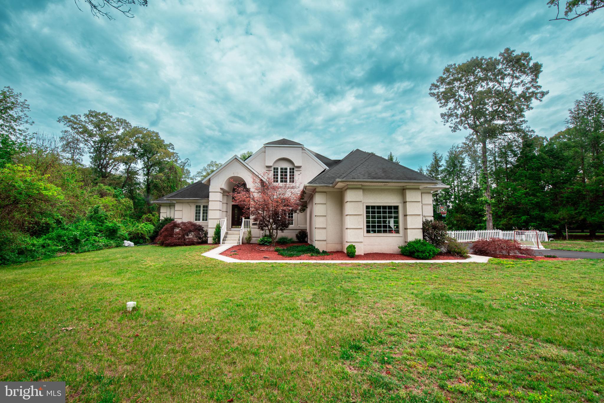 Welcome to 1054 Bayard Road in the Harwood/Lothian area — a stunning French Provincial-style estate ideally located in desirable South Anne Arundel County (SOCO). Set on 2.7 private acres of beautiful land, this exceptional property offers timeless elegance, modern upgrades, and the peaceful lifestyle many buyers are searching for.

Designed with efficiency in mind, the home features 24 rooftop solar panels to help reduce utility costs while supporting sustainable living. From the moment you arrive, you’ll appreciate the impressive curb appeal, mature surroundings, and stately presence of this beautiful home.

Inside, soaring cathedral ceilings, rich hardwood floors, and abundant natural light create a warm yet elegant atmosphere. The inviting floor plan offers spacious living areas ideal for everyday comfort and entertaining alike.

The gorgeous kitchen is the heart of the home, featuring stylish finishes, generous cabinetry, and ample workspace for cooking and gathering. Beautifully updated baths provide a touch of luxury and comfort throughout.

Step outside to your own private retreat where outdoor living shines. Enjoy the in-ground concrete pool, expansive yard, and endless possibilities for entertaining, relaxing, gardening, or simply enjoying the serene natural setting.

Located in sought-after South Anne Arundel County, this home offers the perfect balance of privacy and convenience. With easy access to major commuter routes, including Route 2, Route 4, Route 258, and nearby connections to US-50, commuting to Annapolis, Washington, Baltimore, and surrounding areas is within reach while still enjoying the tranquility of country-style living. Nearby shopping, dining, marinas, parks, and waterfront attractions add to the appeal of this prime location.

30 Minutes from D.C., 45 Minutes from Baltimore, and only 20 minutes from Annapolis. 

A rare opportunity to own a distinctive home with acreage, character, and convenience—schedule your private tour of 1054 Bayard Road today.