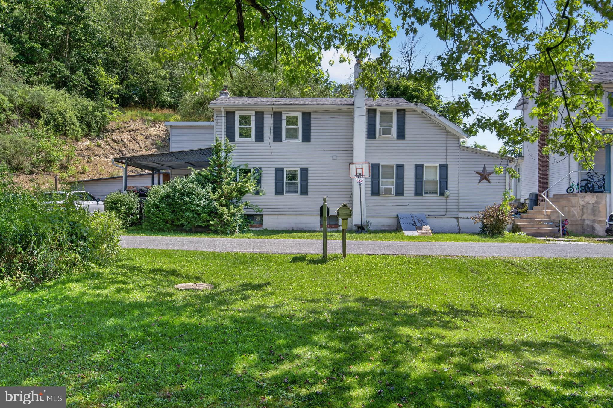 Nestled in the peaceful countryside of West Penn Township, this spacious home offers the perfect blend of charm and opportunity. Situated on a half-acre lot, this 3-bedroom, 2-bath home features over 2,200 square feet of living space with generously sized rooms and a flexible floor plan to fit a variety of lifestyles. The main level features a spacious eat-in kitchen, a welcoming living room, and an impressive great room with soaring cathedral ceilings that fill the space with natural light and create an open, airy atmosphere perfect for entertaining or gathering with family and friends. The first floor also offers a primary bedroom with a walk-in closet and en-suite bathroom, as well as a second bedroom and an additional full bath, and a laundry room, providing the ease and convenience of first-floor living. Upstairs, you’ll find two additional bedrooms, one of which is a walk-through, offering flexibility for a home office, sitting room, or bonus space. Major updates provide added peace of mind, including a roof replaced in 2021, an oil furnace replaced in  2020, electric hot water heater installed in 2019, newer replacement windows,  the septic system was last serviced in July of 2026. Outside, enjoy the relaxing country setting from the covered front porch. Whether you’re looking for room to grow, a property to personalize, or the charm of country living, this home is full of potential. Conveniently located with easy access to Route 309 while still offering the tranquility of rural setting. This is an excellent opportunity to make this  home your own!