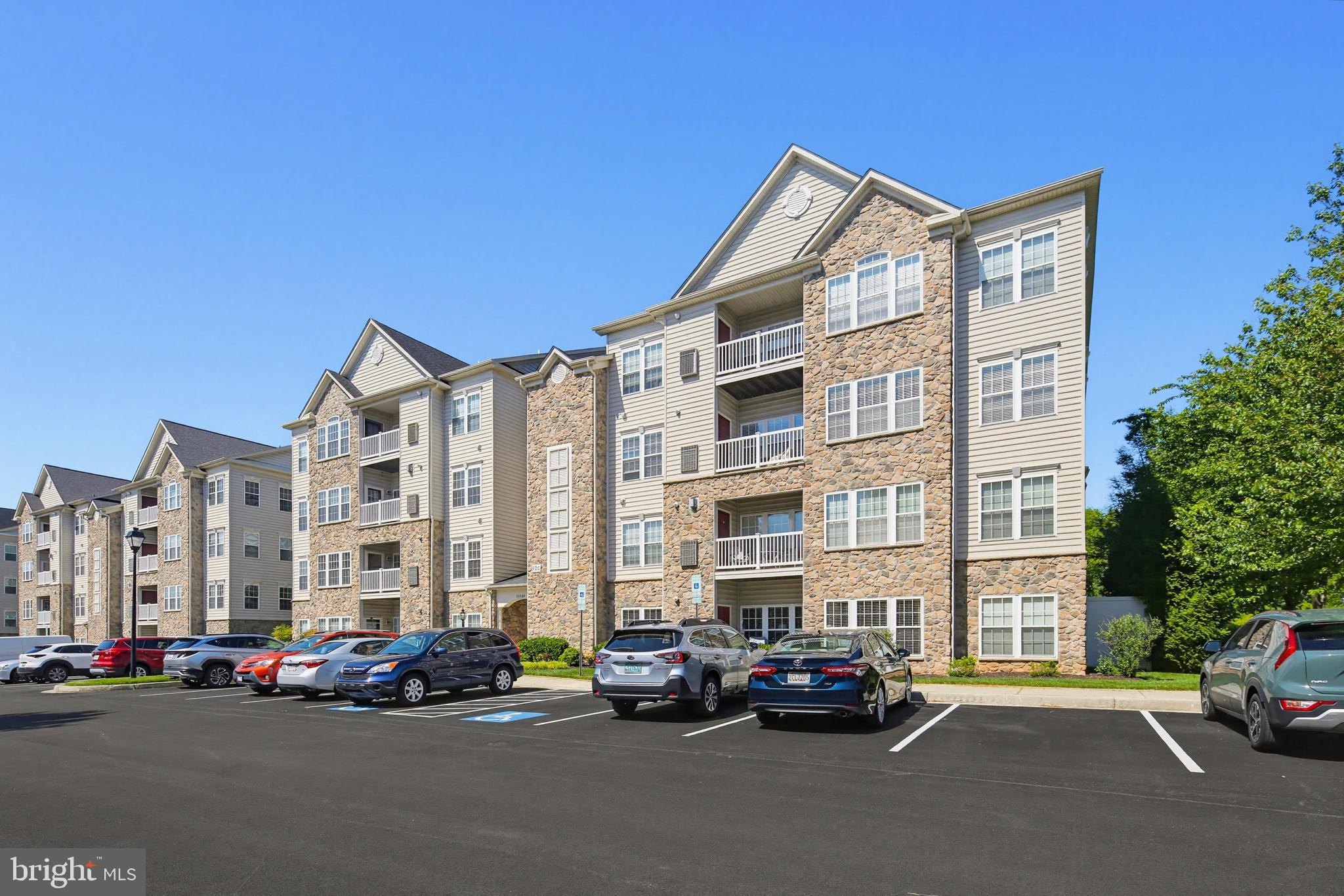 Welcome to the highly sought-after gated,  55+  community of Waverly Woods. 
This beautifully maintained 2 bedroom, 2 bathroom condo on the third floor features hardwood flooring,  plush carpeting, crown moulding, chair rail detailing, and a cozy gas-burning fireplace. The kitchen flows seamlessly into the casual breakfast area with direct balcony access — ideal for morning coffee or evening relaxation.
The inviting primary suite offers a  sitting area, walk-in closet, and an en suite bath with dual vanities. A generously sized second bedroom, full guest bath, and additional storage provide flexibility and convenience for guests or hobbies.
Residents of this active adult community enjoy an abundance of amenities including a pool, pickle ball/tennis courts,  walking and biking trails, and a community center. Conveniently located adjacent to the Waverly Woods golf course and Waverly Woods Village Center with its shopping, dining, and everyday conveniences, this exceptional condo truly has it all.