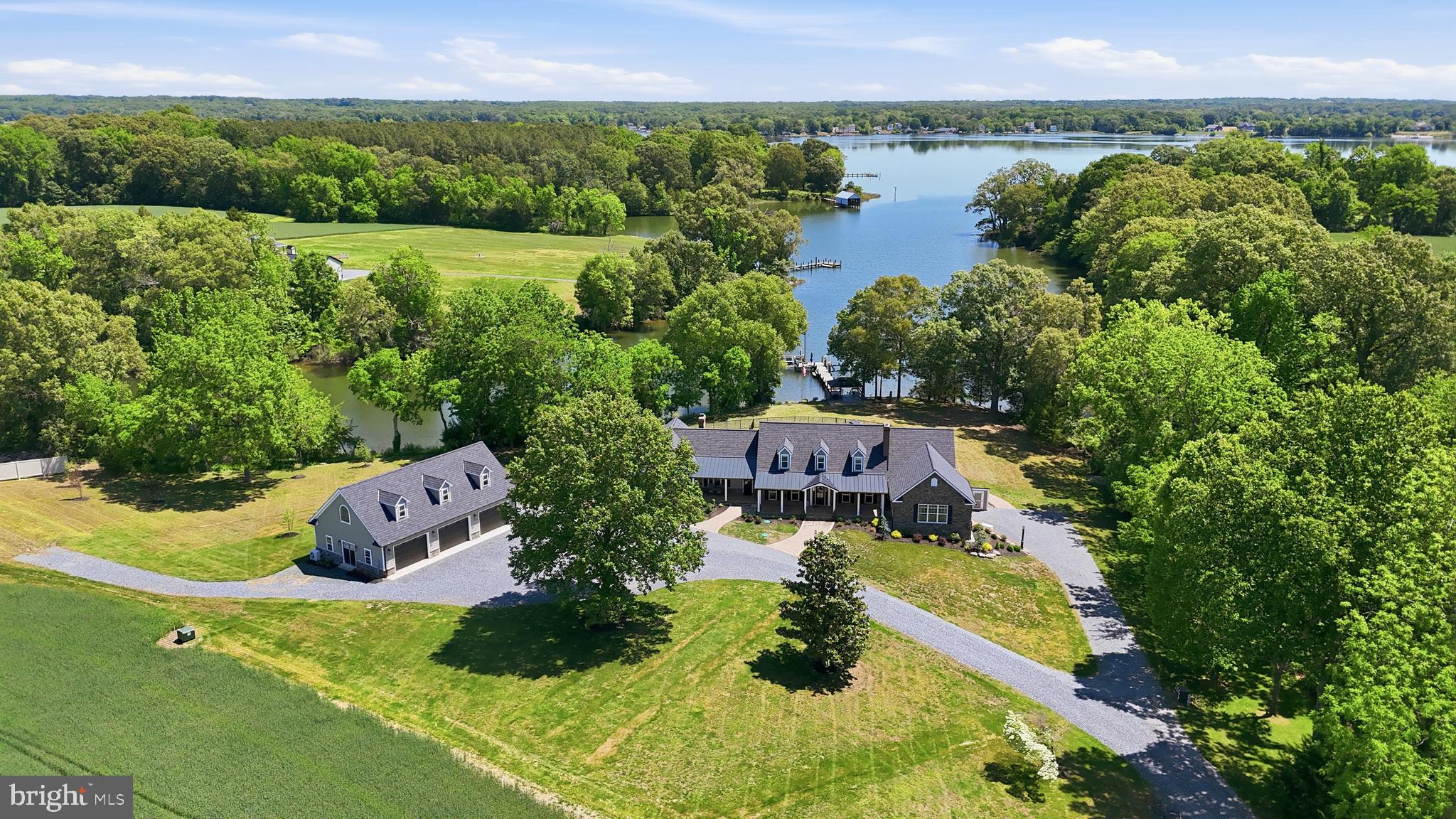 ”The Most Beautiful Waterfront” has been said many times about this property...
20+/- acre waterfront Estate offers so much! Enter Watermark Farm through the gated entrance at 38980 Hodges Road Avenue Md sits on the pristine water of St. Clements Bay w/550’ on Miley Creek just minutes to the Potomac and the Virginia shore.  Easy access to the Potomac as well as a boat ride to Washington DC. Visit Leonardtown only 15 minutes with amenities of the hospital, numerous restaurants, College of So. Maryland and a thriving entertainment/business area and only a short drive to Patuxent River Md (NAVAIR) and easy access to Rt. 301.  The front porches are for reflecting on the beauty this property offers from the field views with wildlife of deer, rabbits and birds to enjoying the water life of eagles, heron, osprey, and ducks.   The newly transformed 5492 sq ft Cape Cod features three bedrooms 4 1/2 bath and additional in- law suite on lower level with private access. Perfect for a Venue, a Farm or the opportunity to have your business. (No HOA) Enter the front foyer to a living room with an open concept. Here you can entertain and access the beautiful kitchen, dining & sunroom. The newly completed kitchen features high ceilings, a 10' island of quartzite; great for entertainment and seating for six. Beautiful custom cabinetry provides storage galore. There are two prep areas with sinks and a view that never gets old. All new GE Café stainless steel appliances to include a six-burner dual fuel range, microwave/convection oven and a traditional extra oven for holiday gatherings, making this a chef’s delight. This home also offers a walk in Butler’s pantry with an additional 48-inch refrigerator and coffee area. Host a dinner party in the expansive dining area with fireplace that expands to the sunroom. Have a conversation or watch the game in the great room just off of the dining area with cathedral ceilings, electric fireplace, a wall of glass siders for views that changed by the minute and easy access to the outdoor veranda.             
The first floor also offers a guest bath, formal dining Room for all the entertainment with fireplace that leads to an office just off of the pool area, the primary suite awaits you with cathedral ceilings, custom walk-in closet with island w/granite, beautiful bathroom and laundry room for ease of chores.
1st floor primary suite with cathedral ceilings, a beautiful custom closet, primary bath and laundry for convenience. Upstairs in a secondary suite with an office area, bath w/ shower & a 3rd guest room with walk-in closets and water views. Relax in the full hall bath.  The lower level offers in-law suite with a living area, kitchenette, and full bath, the lower level also has a separate entrance. There is also an efficient pellet stove. The veranda outside with vaulted ceilings, a ceiling fan with relaxing views anytime of the day. The 4000 square-foot paver patio extends the outdoor living space for any season. The patio area includes views of the river while enjoying your saltwater pool with heater or grilling. The tiki bar houses a TV to keep you up on your sports, wine fridge, beverage fridge, gas grill, Bluetooth music and LED lighting. Only steps from 90' pier with elec. and water and offers 5' MTL. The Pier includes a 25,000lb gear driven boat lift w/remote, 8,000lb boatlift and dual jet ski. This property offers options ... There is a 30’x 60’ barn with concrete floors, water, 200-amp electrical service and a 16’ x 58’ side garage with rollup doors to provide storage for ATV’s, tractors, boats, cars etc. This home also features a 22kw whole house generator, 1000gal buried propane tank supplies generator, pool heater, range, with additional capacity… Hardie Siding, 50 yr arch shingle, new HVAC, 30x50 Garage host a kitchen and full bath and an upstairs loft, with separate elec. service. Pre-Qual required to show, 24hr notice to show