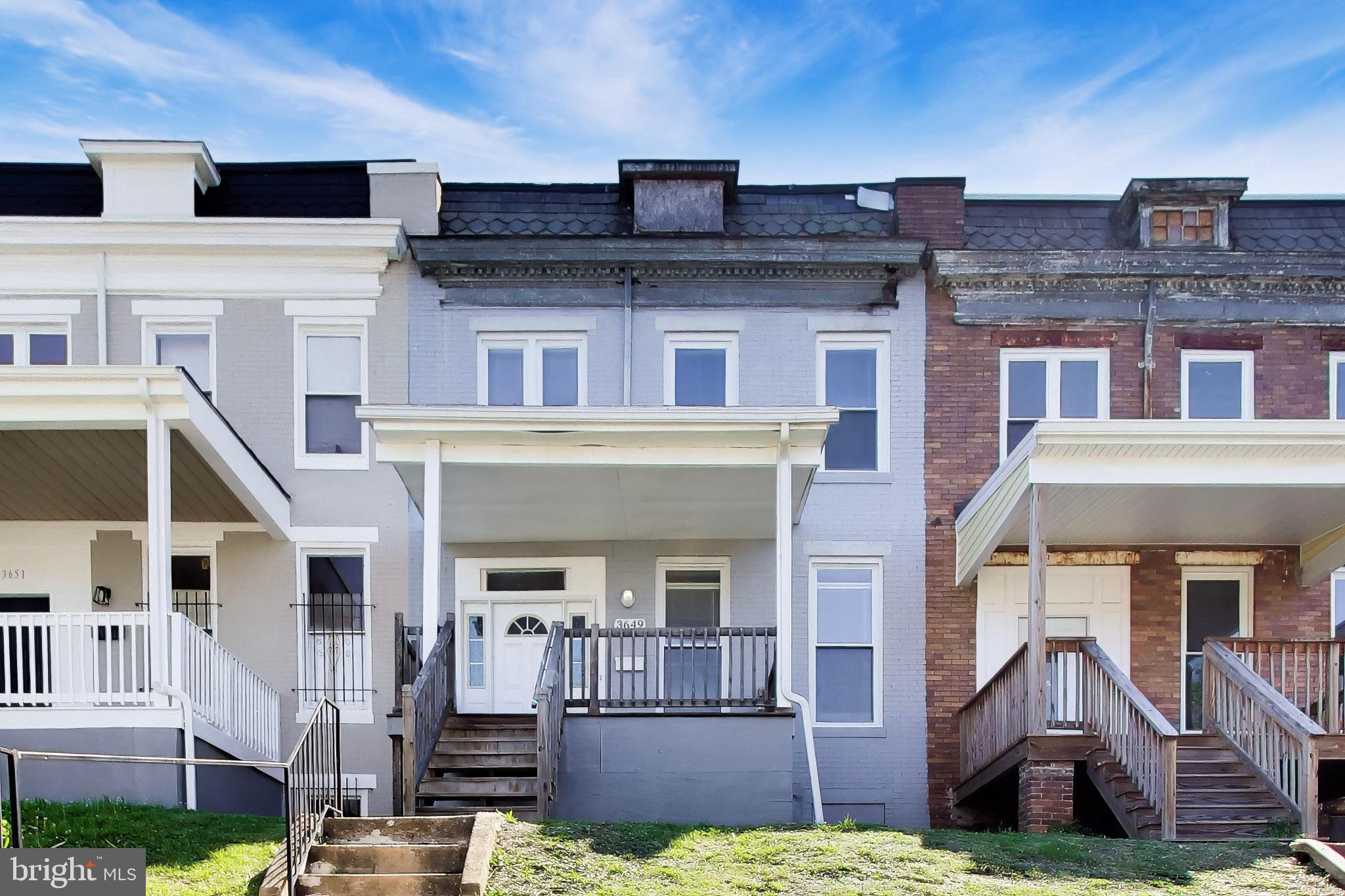 Welcome to this charming, moderately refurbished interior townhouse in the heart of Baltimore City featuring hardwood floors throughout, fresh paint brightens every room, while the updated bathrooms add a modern touch to this classic layout. The upper level includes three comfortable bedrooms, each with great natural light and a spacious unfinished basement provides excellent storage or future expansion potential, giving buyers room to grow and customize. Newer windows were added to enhance energy efficiency, and additional rear parking is a valuable bonus.