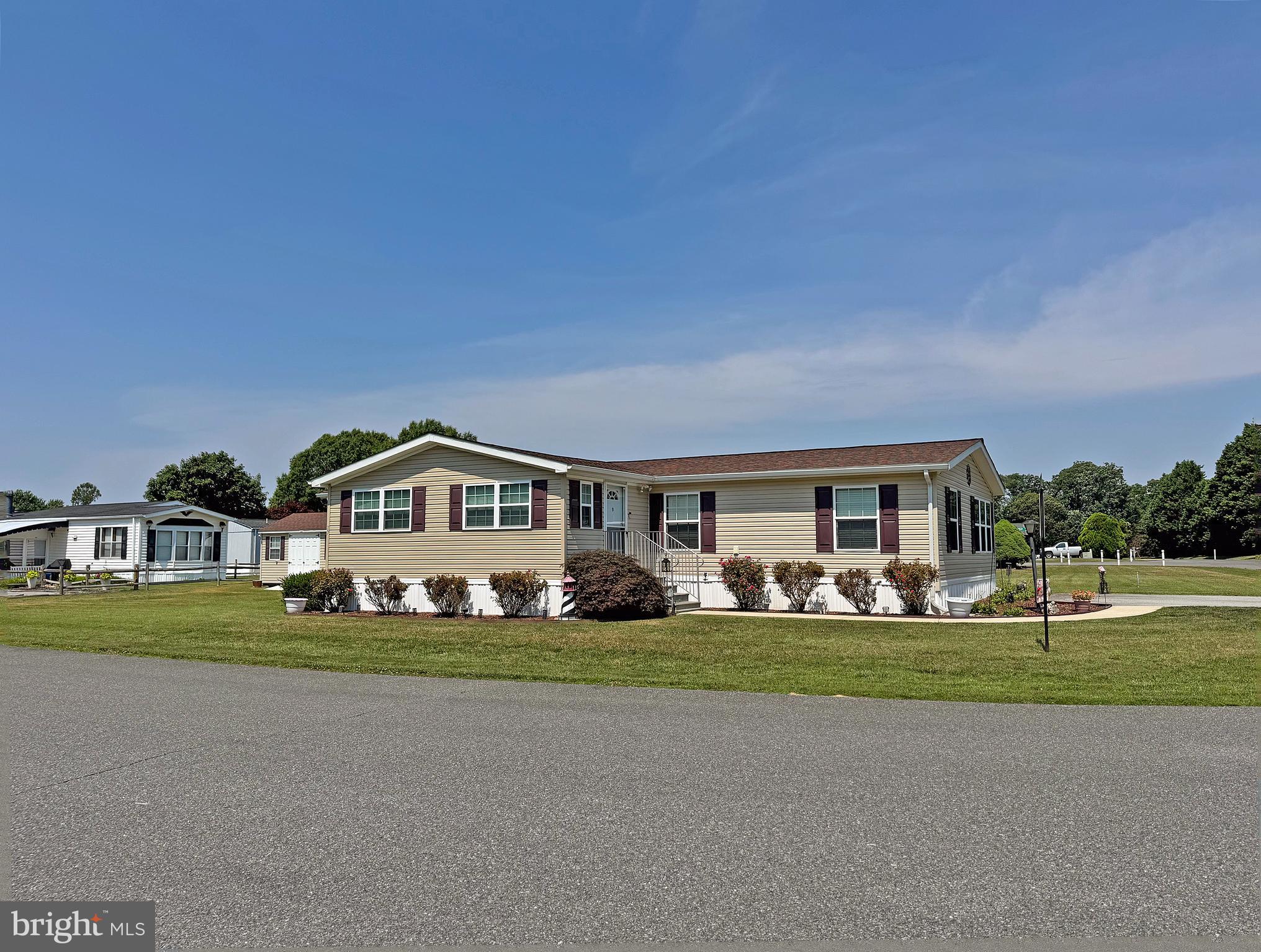 This 2007 Skyline is almost 1,900 sq. ft. with the 12’x24’ sunroom addition!  And it sits on a pretty landscaped corner lot. The home features vaulted ceilings throughout. The sunroom opens to the formal living room. There is also a large family room. The kitchen adjoins the dining room, which has a sliding glass door. Popular split bedroom plan. The main bedroom is en Suite. That bath has a double-sink vanity and a walk-in shower. The other two nicely-sized bedrooms share the second full bath in the hall, which has a tub/shower combo, features a solar tube for extra light. The spacious kitchen has a corner, step-in pantry and a breakfast bar. The appliances include a fridge with ice maker, dishwasher, disposal, electric range, and a built-in microwave. The laundry room is just off of the kitchen. It has a full-size, side-by-side washer & dryer set. Electric forced air heat & central AC, plus lots of ceiling fans. Oversized storage shed for you beach & gardening gear. Driveway parking for 2+ vehicles. Fenced yard, which is perfect for your pets, exists under a legacy clause (no new fences). Annually renewable leasehold interest: 2026 Lot Rent of $760.71/mt. includes water & trash/recycle service (Lease renews annually on Jan. 1 with any increase capped per law – 25 Del. C. Sec. 7050-7054). Homeowner pays electric, sewer, cable/Internet (Xfinity) & lawn service. Silver View Farm allows 2 pets. Pool membership is optional (approx. $175/person with discounted group packages). A Park Application ($76/person) is required for all adults who will occupy the home for 14 or more consecutive days. Buyers are accepted as a Resident in Silver View Farm based on the following criteria: 1.)income verification, 2.)high credit bureau score, 3.)evaluation of debt-to-income ratio, and 4.)criminal background check. Note: Rentals are NOT permitted in this community - but friends & family are welcome to visit you. Financing may be available to qualified borrowers from only a very few Lenders that specialize in installment/chattel loans for manufactured homes on leased land. Closing costs will include a 3.75% “real estate transfer tax” (DMV Doc Fee) & a Settlement Agent Fee.