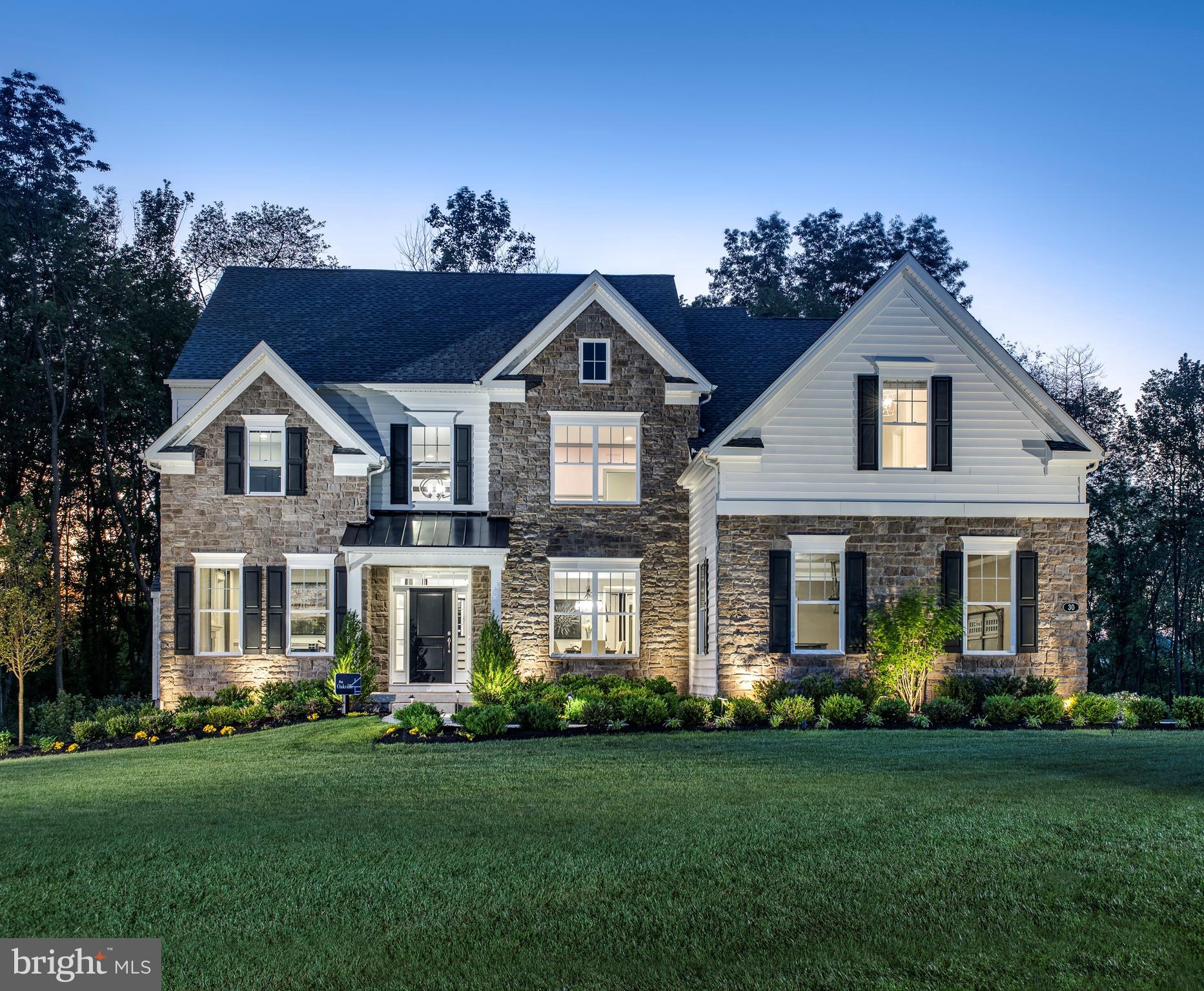 Meadows at Longview, W.B. Home’s highly anticipated community of Estate Homes in Collegeville, PA, from the High $900s is NOW selling! Located in the premium Spring-Ford School District with easy access to an array of shopping, dining and recreation, Meadows at Longview is conveniently located along Greenwood Ave, Upper Providence Township. Residents of the community will enjoy the tranquility of living in a serene neighborhood while remaining close to major urban areas, with quick accessibility to Routes 422. Welcome home to one of our largest floorplans offered at The Meadows at Longview, The Oakville! Coming through the covered front porch, you’ll immediately be taken away by the two-story foyer and curved staircase that welcomes you into your impressive abode. Neighboring the foyer, the living room on one side is the perfect place to unwind with a good book while the formal dining room offers a place to gather with loved ones on the other. Nearby, you will find a convenient powder room and spacious flex room—perfect for an available first-floor guest suite or private study! Walking towards the rear of the home is a massive two-story great room with fireplace and windows on either side for ample natural lighting. Connected to the great room, the breakfast area provides an option for informal dining while the gourmet kitchen is sure to impress any self-proclaimed chef. Adjacent to the kitchen is a walk-in pantry, walk-in closet, and laundry room. Going upstairs to your bedroom level, you’ll find double doors that lead you to your luxurious owner’s suite complete with private retreat, two walk-in closets, and en-suite bath with dual vanities, private water closet, and oversized shower with solid-surface bench seat! Also included on this level are three additional bedrooms, one with an en-suite bath, and an additional full bath in the hallway. Choose to add a fifth bedroom to your home, finish the basement, or add a 4’ extension in the great room to truly tailor your new home to meet your needs. The Oakville is an open-concept dream for those looking for a modern design that will never go out of style. The attached photos and video are of an Oakville Model Home . There is time for you to personalize your home from our extensive on-site design studio.