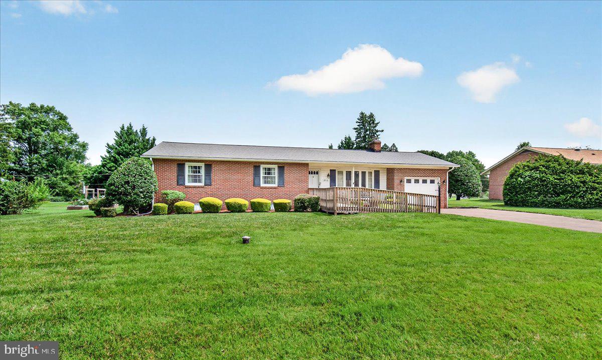 The beautiful brick driveway sets the stage for this meticulously maintained all-brick rancher, offering timeless curb appeal, quality construction, and comfortable one-level living.  Inside, you'll find 3 bedrooms, 2 fully renovated bathrooms, and hardwood flooring throughout the main level. The updated kitchen is both stylish and functional, featuring stainless steel appliances, granite countertops, 42-inch soft-close cabinetry, a built-in pantry, ceramic tile flooring, table space, a convenient main-level laundry area, and a pocket door for added privacy. Step directly from the kitchen onto the brick patio, where you'll enjoy a spacious backyard—perfect for outdoor dining, entertaining, gardening, or giving kids and pets plenty of room to play. A separate formal dining room provides an ideal space for holiday gatherings and family meals.   The primary suite offers a beautifully renovated private bath with a ceramic tile walk-in shower, while the hall bath has also been tastefully updated with ceramic tile and a granite-topped vanity.  
The fully finished lower level expands your living space with a floor-to-ceiling brick wood-burning fireplace, classic vintage paneling, durable luxury vinyl flooring, and endless possibilities for a recreation room, media room, home office, fitness area, or hobby space. The pool table conveys, making it move-in ready for entertaining. You'll also find a spacious utility/laundry room with a utility sink, water softener, and convenient walk-up access to the backyard.  Situated on approximately one-half acre, the property also features an oversized one-car garage, a built-in storage shed, and an expansive backyard with plenty of room to enjoy outdoor living.  This home is not subject to mandatory Clover Hill Civic Association HOA dues; however, the architectural covenants remain in effect. Buyers have the option to join the Civic Association, with 2026 annual dues of just $585 providing exceptional value, including twice-weekly trash collection, two annual bulk trash pickups, weekly yard waste collection from April through December, and membership to the community pool.    Best of all, you'll enjoy no city taxes while being just minutes from historic downtown Frederick, Frederick Community College, major commuter routes, medical facilities, shopping, restaurants, parks, ballfields, and everything the highly sought-after Clover Hill area has to offer.