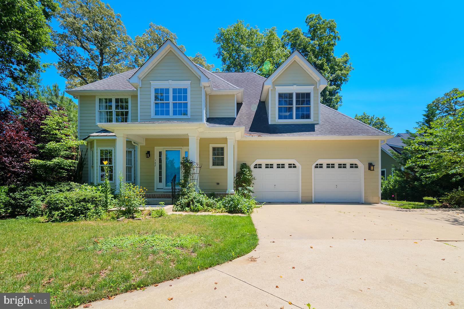 NEW PRICE! Stately and serene, this exceptional 5-bedroom, 4.5-bath residence is perfectly sited on a .48-acre lot along the picturesque banks of Wagamons Pond, offering 4,934 square feet of beautifully finished living space. Thoughtfully designed for both elegance and accessibility, the home features a two-level, partially covered deck with a wheelchair-accessible ramp and tranquil water views.
The entry level welcomes you with a gracious living room and formal dining room, both showcasing rich Brazilian cherry hardwood floors. This level also includes a powder room, a laundry/mudroom, and a convenient 3-station elevator. The chef’s kitchen is outfitted with stainless steel appliances, Cambria quartz countertops, abundant cabinetry, and Mexican clay tile flooring that continues into the sunlit breakfast room with access to the screened porch. Two luxurious owner’s suites provide flexible living options—one on the entry level and another on the second floor. The main-level owner’s suite features hardwood flooring, a walk-in closet, and a spa-inspired ensuite bathroom with dual sinks, a soaking tub beneath a chandelier and window, tumbled travertine floors, and a roll-in shower accented with tile and glass mosaic. The second-floor owner’s suite offers plush carpeting, a skylight, and an ensuite bath with tumbled travertine flooring. This level also includes a comfortable family room, two additional guest bedrooms, and a full bathroom with ceramic tile. The mostly finished English basement expands the living space with a spacious family room with access to the spacious rear deck, bedroom, full bathroom, and durable luxury vinyl tile flooring—ideal for guests or multi-generational living. Additional highlights include Hardie Plank siding, oversized downspouts, a gutter guard system, irrigation system, split climate controls, and an insulated garage with water, sewer, and electric. Located in an upscale neighborhood in vibrant Milton that adjoins the community bike path, this home is just a short walk to dining, parks, local events, and the farmer’s market—offering the perfect blend of refined living and everyday convenience. Please ask for a list of Highlights and Upgrades!
