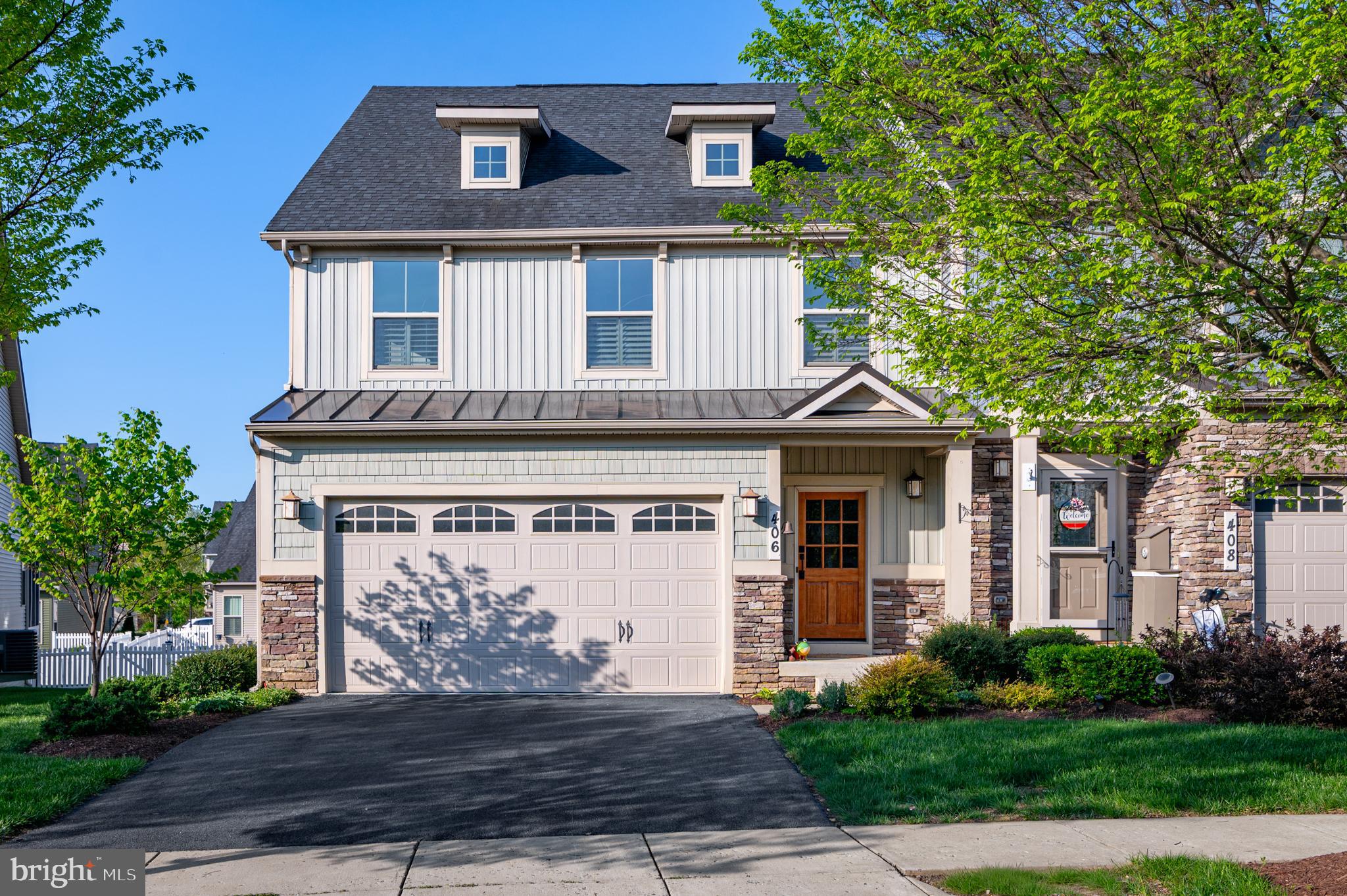 Welcome to this beautiful Griffin Hall end-unit villa with Scandinavian flair on a quiet tree-lined street in desirable Brunswick Crossing.  Walking through the front door you are greeted by a double-story foyer that draws your attention both upward and inward to the heart of the home with its open layout. You will immediately notice the gorgeous blonde solid oak floors, the fresh paint throughout, and the plantation shutters on all the windows which really elevate the charm and elegance of this popular model. 

The kitchen with its white shaker cabinetry, lovely granite countertops with an extension for additional seating, and stainless steel appliances is a delight to cook and entertain in. The kitchen opens up to a dining area with plenty of seating possibilities which in turn opens up to the family room with soaring ceilings. This villa has the family room bump-out for an additional 100+ sq ft of main floor with a row of windows, and a patio door through which you access the deck. The MAIN LEVEL PRIMARY SUITE with large bathroom and walk-in closet, as well as a practical mudroom with laundry and powder room from the 2-car front-loading garage truly makes this a one-level living for most all your needs. 

Walk up the oak stairs to a beautiful loft space that overlooks the family room below. Perfect as an office or second living room. You will also find two spacious bedrooms with walk-in closets, a hall bath and an additional smaller bedroom with window, perfect as an office or hobby room. The basement is unfinished and offers great additional space for your imagination and creativity. Rough-in for full bath exists, and there's a direct exit to the spacious and level backyard! 

Mowing in the front and back is included in the HOA fee, as is the swimming pool, tennis courts, fitness center and many other amazing amenities in Brunswick Crossing including dog park, community garden, walking trails, tot lots and more! MARC train station and great commuter roads are just minutes away for easy commuting too! Welcome!