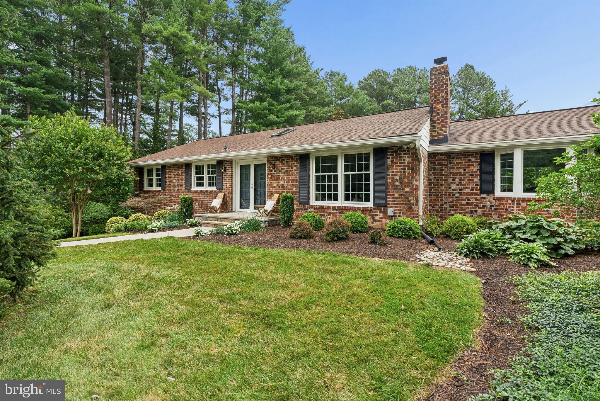 Privacy abounds at this spectacular corner lot, custom built Rancher. Perfectly sited on nearly one
acre in the coveted Ellicott City community of Allenford, this natural setting is truly one-of-a-kind.
Botanical quality gardens are surrounded by specimen trees, lush shrubs and vibrant perennials.
The backyard is an entertainers dream featuring extensive hardscape that surrounds the expansive
patio. All of this overlooks the island inspired pool, lounging area and dining area under the gazebo.
Sound system and poolside speakers and strategically placed garden and pathway lighting tops off
the vibes of the day.  Inside you will find a meticulously maintained and sun-filled living space. Four  skylights add to the ambiance of select rooms. Three Bedrooms, two Full Baths, Formal Living and Dining Rooms, fabulous Family Room addition with an impressive brick front, wood burning Fireplace and efficient Kitchen completes the main level. The Lower Level accommodates movie and game nights fireside in the Recreation Room. The used Baltimore brick featured wall and raised hearth, brick front
Fireplace is a cozy spot to entertain.  Laundry Room,  Utility Room Storage Room and entry to the
over-sized two car, side entry Garage are all accessed from the Lower Level. The history of updates,
major improvements and maintenance is available upon request.  No expense has been spared to
present this gem in the Marriotts Ridge School District. No mandatory HOA is an additional bonus.