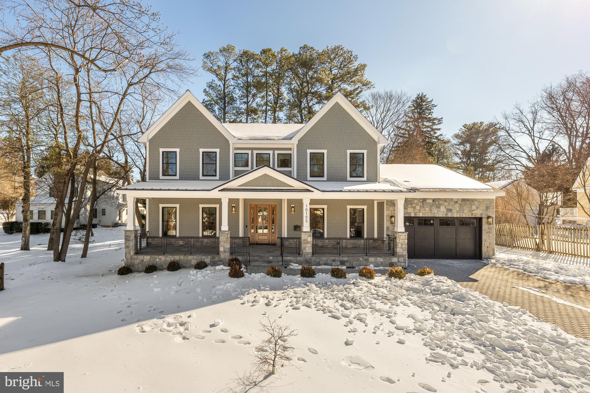 Welcome to 10105 Summit Avenue, a truly exceptional home where thoughtful design meets meticulous craftsmanship in one of the area’s most sought-after neighborhoods. Built to specification with an emphasis on flow, comfort, and elevated living, this Chevy Chase View residence offers generous spaces, custom details, and luxe finishes at every turn.

Step through the welcoming entry, flanked by an inviting sitting room to one side and a dining room to the other, and discover soaring ceilings that create an immediate sense of openness. Walk through to an expansive open-concept kitchen and family room—sunlit, warm, and overlooking an incredible fireplace, impressive covered porch, and backyard. A large half bath, mudroom, exceptionally private home office, and an impressive walk-in pantry add function and style, while wide stairwells and hallways add to the overall sense of spaciousness throughout the home. This level also allows access to a 2 car garage.

Upstairs, you’ll find four beautifully appointed bedrooms, including a serene primary suite with a massive, spa-inspired shower in the luxe ensuite. Every upstairs bedroom has an ensuite, and every bathroom throughout the home exemplifies luxury, showcasing premium materials and intentional detailing.

The lower level is equally remarkable, featuring two additional bedrooms—one with an ensuite bath—ideal for guests or multigenerational living. A huge mirrored room offers endless possibilities for a home gym, dance or yoga studio, or creative workspace. The expansive rec room with a custom bar sets the stage for effortless entertaining and relaxation. The home is served by a 75 gallon hot water heater and two gas furnaces.

Designed for those who appreciate quality and crave space, this home blends sophistication with everyday comfort. From the custom finishes to the wide halls and the beautiful outdoor property, every inch reflects high-end intention and enduring style.