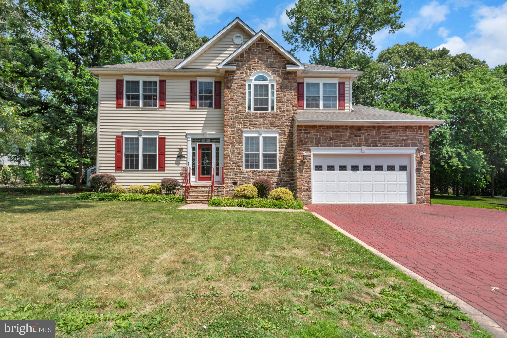 Welcome home to this beautifully thoughtfully updated and move-in ready home! This exquisite traditional home, built in 2008, offers a perfect blend of luxury and comfort. With its stunning brick front and vinyl siding, the exterior exudes timeless elegance, while the meticulously landscaped grounds invite you to explore the expansive 0.29-acre lot. Step inside to discover a thoughtfully designed interior that radiates warmth and sophistication. The kitchen is a chef's dream, featuring face-frame cabinets common in high-end kitchen, hidden shelves for spices and kitchen gadgets, upgraded countertops, a spacious island, and well maintained appliances, including a built-in microwave, self-cleaning oven, and a sleek dishwasher. The combination of luxury vinyl plank and marble flooring adds a touch of opulence throughout the main living areas. Retreat to the primary suite, where you'll find a lavish bathroom complete with a jetted tub and a walk-in shower, providing a spa-like experience right at home. Each of the four bedrooms is generously sized, offering ample closet space, including walk-in closets that cater to your storage needs. The additional bathrooms are equally impressive, featuring modern fixtures and finishes. The fully finished basement is a versatile space that can serve as a recreation room, home office, or guest suite and interior access. A charming gas fireplace, adorned with stone, creates a cozy focal point in the family room, perfect for those chilly evenings. Enjoy the outdoors with expansive back yard, ideal for summer barbecues or quiet evenings under the stars and private access to Magothy River (five-minute walk). The property also features an attached garage and a shed, ensuring you have all the space you need for your hobbies and vehicles. Safety and efficiency are paramount, with energy-efficient windows, smoke detectors, and carbon monoxide detectors in place. The home is equipped with modern conveniences, including a front-loading washer and dryer located conveniently on the upper floor. This residence is not just a home; it's a lifestyle. Experience the perfect blend of luxury, comfort, and functionality in a setting that feels like a retreat. Don't miss the opportunity to make this stunning property your own.