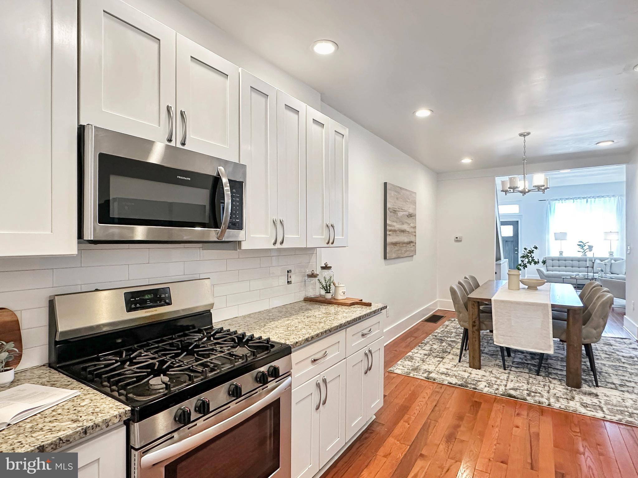 2.5+ years left on TAX ABATEMENT! And, eligible buyers may have access to assistance programs up to 5% of purchase price. Welcome home to 1730 N 29th Street, an exceptional value and thoughtfully designed gorgeous home offering 3 bedrooms, 2 full baths, 1 half bath, with approximately 1,300 square feet of finished living space plus a FULLY FINISHED BASEMENT, hardwood floors and CENTRAL AIR throughout and TWO OUTDOOR SPACES. From the large front porch, step inside to an OPEN LAYOUT, light-filled main level featuring a floor plan for enjoyable everyday living and entertaining with SPACIOUS  living room, dining room and kitchen areas. The stylish kitchen anchors the space with modern finishes and flows seamlessly into a rear mudroom with laundry and a convenient powder room and onto the back patio—perfect for outdoor dining, gardening, or relaxing evenings at home.
The finished basement adds flexible bonus space with excellent lighting, ideal for a media room or second living room plus a home office, or workout area.
Upstairs, the primary suite offers dual closets and a PRIVATE ENSUITE BATH with a contemporary vanity and walk-in shower. Two additional bedrooms and a full hall bath complete the upper level.
Ideally located near Fairmount Park, enjoy easy access to biking and hiking trails, recreational fields, golf, and convenient SEPTA transportation. A move-in-ready home combining space, style, and location—with 2.5 years remaining on the tax abatement! Schedule your tour today because this won’t last long!