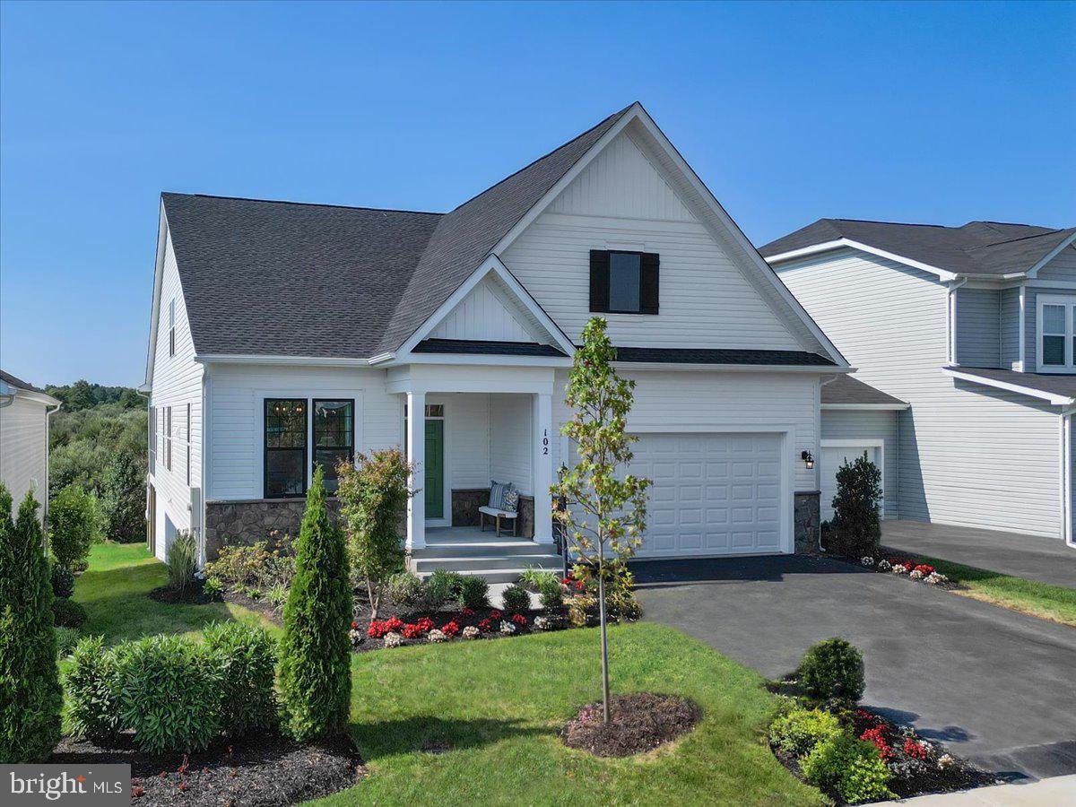 This former builder model provides a unique opportunity for main level living without age restriction within highly sought after Snowden Bridge! Located at the end of a cul-de-sac, this three-level residence boasts four bedrooms, four bathrooms, and a two-car garage, offering ample space for comfortable living.
Upon entering, you'll be greeted by a private home office featuring French doors, adding versatility to the main level. The luxurious primary suite is a true retreat, complete with two walk-in closets and an en-suite bathroom featuring dual vanities, an expansive shower, and a relaxing soaking tub. Two secondary bedrooms, a full bathroom, and a spacious laundry room with side by side washer and dryer are also conveniently found on the main level.
 The heart of the home is the kitchen, featuring beautiful Cararra quartz countertops, Gourmet Stainless Steel appliances, a spacious island, ample counter space, and grey and white cabinetry. A breakfast nook, bathed in natural light from elongated windows, opens to the family room. The soaring vaulted ceilings of the family room create a bright and airy atmosphere, leading to a screened-in covered porch where you can relax and enjoy the lush green views.
An oak staircase leads to the upper level which offers an open loft overlooking the grand room below, an additional bedroom, and a full bathroom.
The walkout basement presents endless possibilities for entertaining. The expansive recreation room is complete with a full bath, and there are two unfinished spaces providing ample storage or future customization.
Snowden Bridge community has a plethora of amenities including a pool, indoor sports, trails, dog park and so much more!