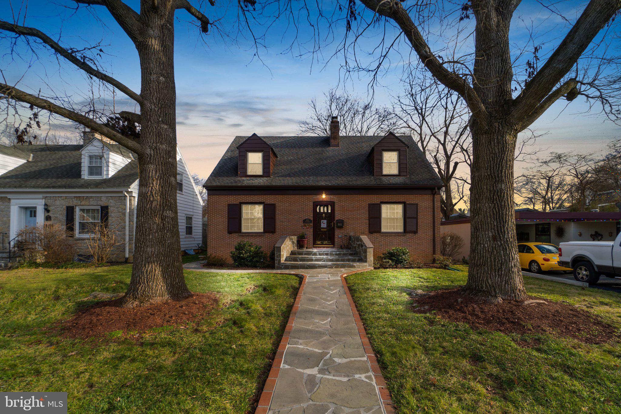 Welcome to this charming and elegantly stone landscaped Cape Cod home nestled in the sought after North End of Hagerstown. This immaculate home features a renovated kitchen with beautiful countertops, ceramic backsplash, stainless steel appliances, and plenty of cabinet space. The main level boasts a large primary bedroom with a full bath, separate dining room and living room  with  cozy  wood burning fireplace and hardwood floors with plenty of natural light. The bathrooms have been fully updated with modern fixtures and tile flooring. The spacious basement offers a wet bar, another wood burning fireplace, and recreation area floors have been updated to LVP. The backyard is a private oasis, you can enjoy the view and mature trees  from the inclosed sunroom or paved patio. There is private parking under the carport or the long driveway. In addition there is plenty of storage area in the attic or outside in the cover shed. Current owners have also updated the dual HVAC system, windows and paint. Roof is about 9 years young. This home is conveniently located close to schools, shopping, and major highways. Don't miss the opportunity, hurry and schedule your private showing!!