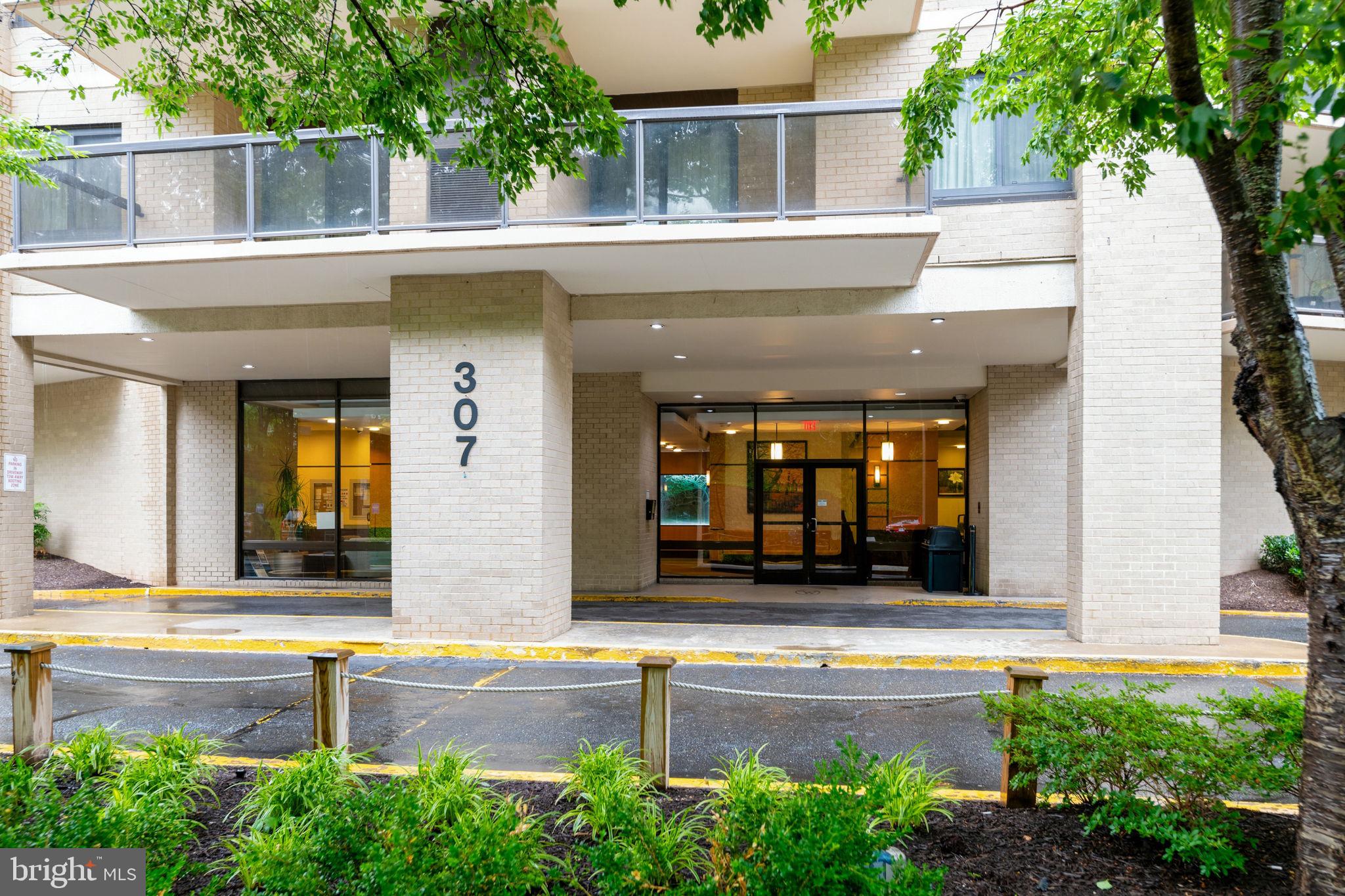 Spacious 3-bed condo in Alexandria: Is there a spacious resort style condo near Washington DC, Alexandria, the Pentagon, National Airport, and the new INOVA complex?  Unit 512 at 307 Yoakum Pkwy offers 3 bedrooms, 2 baths, 1,621 sqft, two parking spaces, included utilities, and a private corner layout at Watergate at Landmark. Welcome to Watergate at Landmark, a gated Alexandria community known for resort style living, mature greenscape, and unmatched convenience across 37 landscaped acres. This corner unit shares only one party wall, giving the home a sense of privacy while showcasing spacious rooms and a classic layout with a natural flow for entertaining. The bedroom wing is thoughtfully separated for privacy, while the living room features custom built ins and a sliding glass door to a large covered balcony overlooking a gazebo and greenery. The large galley kitchen offers excellent storage options, space for seating, and a comfortable work flow. The spacious owner's suite includes an adjoining bath with dual vanities, a classic glass block shower, a large walk in closet, and a secondary closet for added storage. The second and third bedrooms are both spacious with good sized closets and large windows. The hall bath features a spa tub and recently updated vanity and sink, while the hallway includes two additional linen closets for even more storage. Additional storage is in the foyer with 3 closets as well as dedicated secure storage in the lower level.  Each residence has its own HVAC system for consistent temperature control, with key updates including HVAC in October 2021, Bosch dishwasher in 2020, LG refrigerator in January 2023, LG washer and dryer in April 2020, garbage disposal in July 2025, and custom shades in the bedrooms and dining room. The monthly condo fee includes electricity, gas, water, sewer, garbage, building antenna, parking, and access to indoor and outdoor pools, tennis, pickleball, volleyball, putt-putt, indoor driving range, fitness center, library, convenience store, restaurant, bank, hair and nail salon, and more. A tunnel system connects residents to the fitness center and indoor pool without traveling outside. This 3-bed condo in Alexandria could use some updating and is ready for its next owner to refresh and shine.