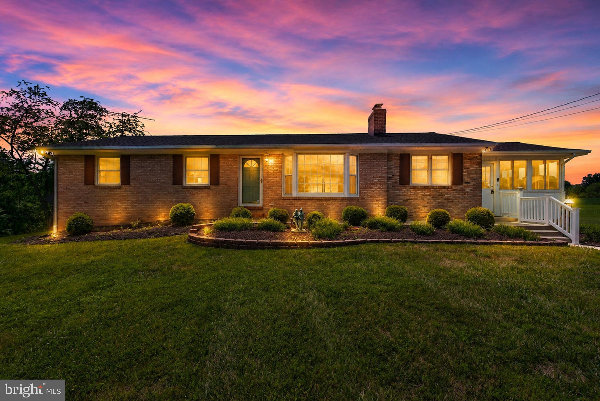 Welcome Home! Perched atop an expansive 1.56 +/- acre lot sits this well maintained and thoughtfully updated rancher, now offered for sale for the first time since its construction in 1964. The main level features an expansive eat-in kitchen with 42" oak cabinetry, brick accent walls and a connecting sunroom, a large bay window and wood-burning fireplace in the living room, updated hall bath with Schluter Systems heated floors and a custom walk-in shower, and four generously sized bedrooms across its 1,568 finished sq. ft. The lower level offers additional space to entertain with a 24'x12' family room, bonus/hobby room, second updated full bathroom, dedicated laundry area, storage space and its own ingress/egress  through the cellar way. Other notable upgrades include a newer architectural shingle roof, freshly paved 5+ car driveway, carpeting (with oak hardwood underneath on main level) and a professionally painted interior. Surrounded by nearly 125 acres of preserved farmland via the Harford County Agricultural Land Preservation Program, this home ensures same stunning pastoral views for generations to come. To top it all off, your new home is located just minutes from the Fallston Village Shopping Center, Fallston Middle and High Schools, and commuter routes like 152 and Harford Rd... offering premier access to shopping, schooling, and work while still retaining the peaceful atmosphere that makes Fallston so special. Call your agent and schedule your private tour today!