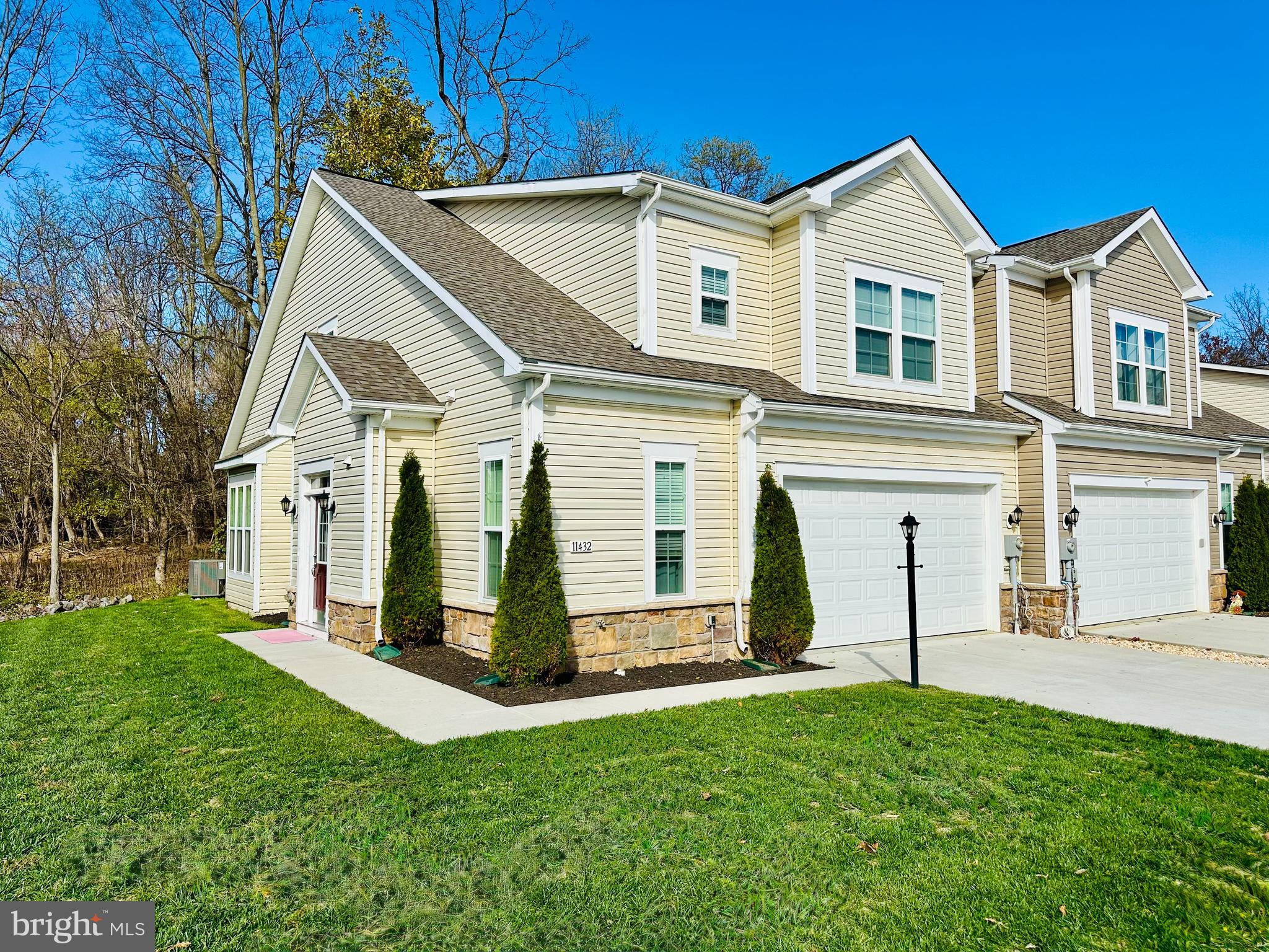 End-unit luxury meets effortless living! This stunning townhome welcomes you with a spacious foyer and sleek luxury vinyl plank flooring. The heart of the home features a gourmet kitchen with custom cabinetry, quartz countertops, stainless steel appliances, and an expansive island perfect for entertaining. The open-concept design flows seamlessly into a dramatic two-story family room, bathed in natural light from vaulted ceilings and oversized windows. Enjoy the convenience of a main-level owner’s suite—a true retreat featuring a walk-in closet and a spa-like bath with a dual-person soaking tub and separate shower. The main floor also includes a laundry room and half bath for total accessibility. Upstairs, discover three generous bedrooms and a second full bath. Complete with a two-car garage and a low-maintenance lifestyle where the community handles the lawn care. Perfectly situated near dining, shopping, and easy commuter access to I-70 and I-81.