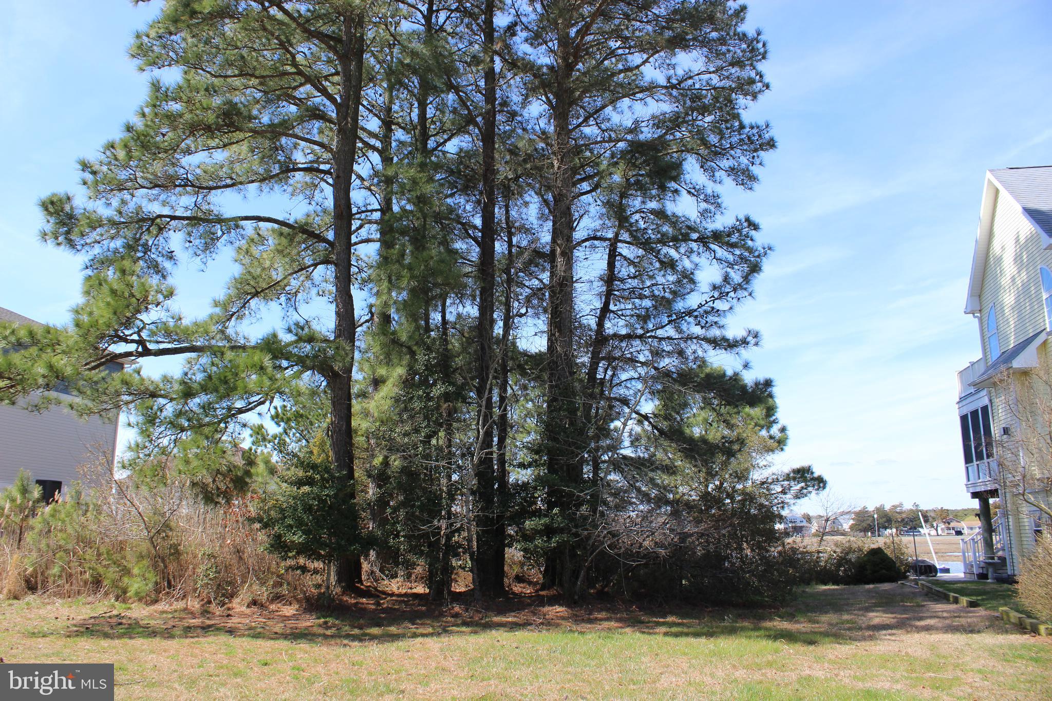 1/1213 Location, Location! One of the best waterfront properties in Captain's Cove that has unobstructed views over the Marshland & Marina Club. Enjoy the beautiful sunsets and launches from Wallops Island from the comfort of your own private deck. Protected canal front lot that feeds directly into the Chincoteague Bay. Come and see for yourself and you will agree! To appreciate the view I encourage you to step outside your car and walk to the back of the lot...PRICELESS!!!! Approx. 84' of vinyl bulkhead. Great value! HOA amenities: Pristine 9 Hole Golf Course, indoor/outdoor pools(2), fitness center, pickle-ball & basketball court, playground, biking & walking trails, picnic area, dog park, security and so much more. Call for more information.