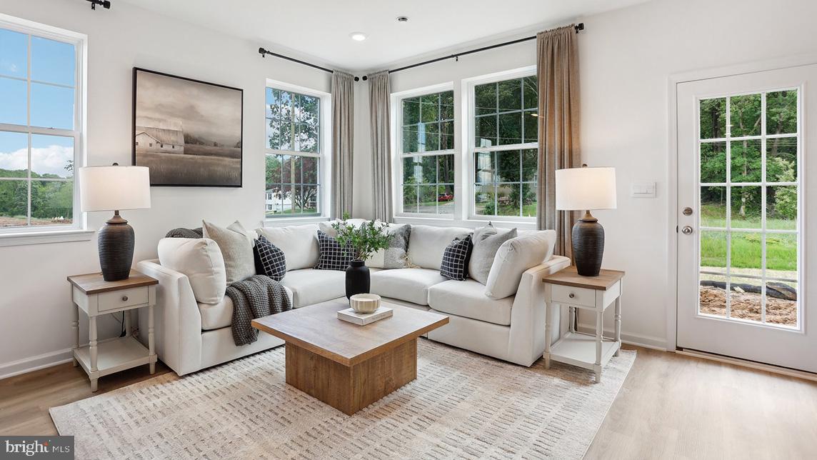 END UNIT with extra windows, added outdoor space, and great natural light in a quiet-low traffic setting with wooded views. 
Discover "The Delmar," a smart and spacious two-story end-unit townhome designed for practical, contemporary living. Spanning 1,500 square feet, this thoughtfully crafted plan features 3 comfortable bedrooms, 2.5 stylish baths, and a convenient 1-car garage.
Benefit from the unique advantages of an end unit: enjoy abundant natural light streaming in through extra side windows and the enhanced privacy that comes with having only one shared wall. Step outside to a noticeably larger side yard, offering expanded outdoor living space perfect for relaxation or play.
The main level presents an inviting open-concept layout. The modern eat-in kitchen boasts a large pantry, a functional central island, and seamlessly flows into the airy, sunlit dining and living areas—perfect for everyday life and entertaining.
Upstairs, retreat to the private living quarters. The comfortable owner’s suite includes a large walk-in closet and a private owner’s bath with a spacious walk-in shower and dual vanity. The two additional bedrooms offer ample closet storage, and the smart floor plan includes a convenient hall bath and an upstairs laundry area, making chores a breeze.
Experience the significant benefits of brand-new construction: peace of mind is guaranteed with a builder’s warranty. This home provides the low-maintenance lifestyle you desire with the solid amenities and design you deserve. One of the best parts? ALL appliances are included! 
Priced for today's market and built for lasting comfort, this premium Delmar end unit is waiting for you—schedule your tour today and explore the possibilities of enhanced homeownership! *Photos are representatives and colors may vary.