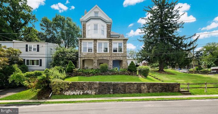 Welcome to 7301 Chestnut Avenue, where city convenience meets suburban calm. This grand triplex sits on .27 acres with solar panels, a large driveway, a two-car garage, and a second detached garage, ideal for additional parking or storage, offering both stability and upside for owner-occupiers or investors. Unit 1 is tenant occupied, receiving $2500/month and unit 3 is tenant occupied receiving $1500/month, and one of the garage spaces rented for $500/month. Units 2 is vacant. Great to add value or rent out right away! A ton of potential with this property. 

Each of the three units has its own kitchen, full baths, and unique character across three levels of living space. The first-floor unit features three bedrooms, two full baths, and a spacious kitchen that opens to the rear yard. Upstairs, the second-floor unit offers another three bedrooms and a full bath across more than 1,200 square feet, complete with in-unit laundry. The third-floor unit includes one bedroom and one bath with natural light throughout. 

The property’s outdoor areas are a standout: a fenced front yard with a covered porch and garden, plus a semi-private backyard with a patio and mature landscaping, perfect for quiet mornings or casual get-togethers. The basement includes shared laundry facilities and additional storage. Positioned between Center City and the suburbs, this location combines convenience with a relaxed residential feel, minutes from restaurants, cafés, and regional rail. A well-maintained, income-producing triplex ready for its next chapter. Schedule your showing and see why this property stands out.