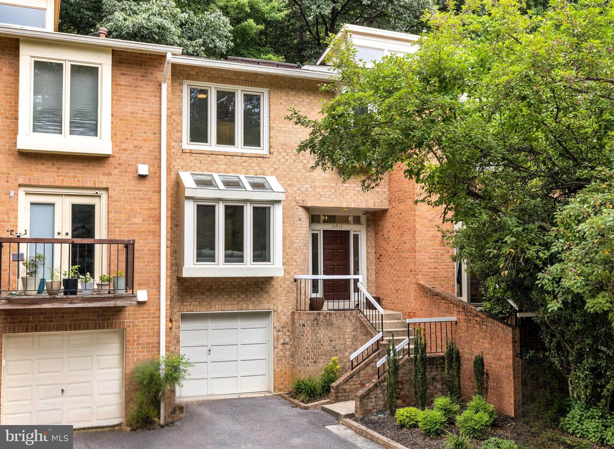 Rarely available townhome in Potomac’s sought-after Whitman school cluster, backing directly to parkland and just minutes from the C&O Canal, hiking trails, and Old Angler’s Inn — an outdoor lifestyle few Potomac addresses can match.

Inside, over 2,500 finished square feet across three levels. The main level’s open living and dining space is anchored by hardwood floors and a large bay window; the renovated eat-in kitchen pairs quartz counters and stainless KitchenAid appliances with an oversized walk-in pantry. Off the kitchen, the deck looks straight into the trees — morning coffee with no rear neighbors.

Upstairs, the primary suite includes two walk-in closets and a renovated bath with soaking tub and glass-enclosed shower, plus two additional bedrooms and an updated hall bath. The walk-out lower level offers a recreation room with wood-burning fireplace, an updated half bath, and access to the attached garage.

Move-in ready, with Potomac Village shopping and dining and major commuter routes close at hand.