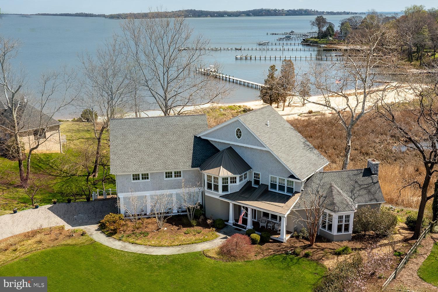 THE ULTIMATE WATERFRONT in ULMSTEAD!  Make Magothy River memories in this CUSTOM CRAFTSMAN with 800’ of prime water frontage including private beach & boating/fishing pier! Bask in Bay sunsets from a maze of upper & lower decks and your hot tub, gazing out over tidal wetlands and the fabled river spilling into the Bay. Revel in walls of water view windows (ALL BRs), textures of hardwoods, granite & tile, ceiling fan breezes, and skilled built-ins throughout!  Stunning formal & casual living spaces with Seller paid bi-monthly cleaning/housekeeping!  Stainless chef’s Kitchen with water view dining banquette, island dining bar, walk-out to deck, & adjoining Family Room!  Primary BR Suite with deck, Office/Nursery, Sunroom, luxury Bath & walk-in closet.  3 Additional BRs (one with deck); 2 Full Baths.  Multi-vehicle drive; 2-car garage. Sought-after community of  approx. 360 homes located on the Baltimore/Washington corridor just north of Annapolis. Ulmstead Estates offers 2 marinas, boat slips, boat ramp, kayak/paddle board racks, swimming pool /Swim Team, lighted tennis courts, waterfront playground, volleyball and basketball, baseball and soccer/lacrosse fields, and Equestrian Center/barn perfect for social gatherings. Broadneck Blue Ribbon public schools.  THE ULTIMATE in AMENITIES - INDOORS & OUT!