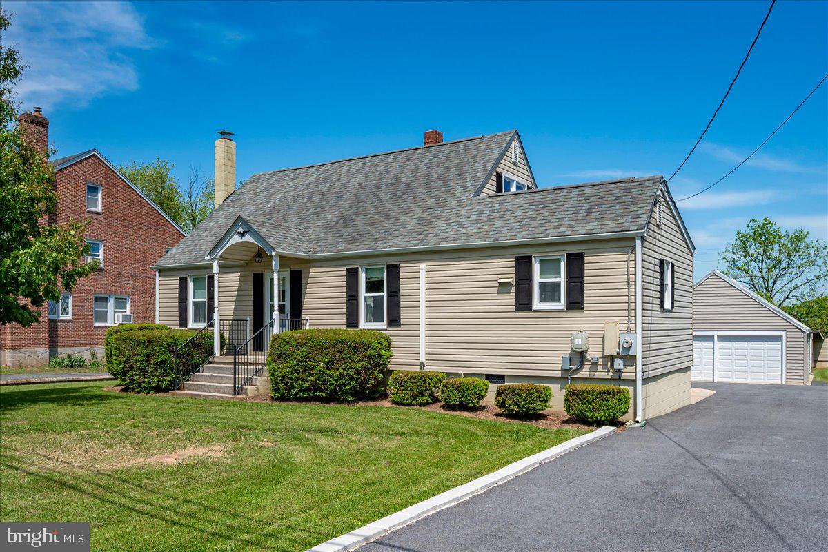 NEW PRICE! Welcome to 11205 Hessong Bridge Road in Lewistown, a charming 4-bedroom Cape Cod home nestled on nearly half an acre offering peaceful country surroundings while still being just minutes from schools, shopping, and everyday conveniences. Backing to open farmland, this home provides a sense of privacy and space where you can enjoy morning coffee at sunrise, gardening, or relaxing in the expansive backyard.  Inside, the spacious kitchen features abundant countertop space, a double sink, custom wood pantry doors, a large eat-in area, and abundant natural light, creating a warm and functional gathering space. The main level offers a comfortable living room, two bedrooms, and a full bath. Upstairs, you’ll find two additional bedrooms, a half bath, and a versatile bonus room ideal for a home office, exercise room, or hobby space, complete with a separate rear staircase leading outside. The unfinished basement offers a laundry area, a utility sink, and plenty of additional storage. The oversized garage offers plenty of space for vehicles, a riding mower, and all of your outdoor equipment, with room for bikes, kayaks, tools, or even a boat. Whether you enjoy outdoor adventures, hobbies, or simply appreciate extra storage and workspace, this garage provides the flexibility and convenience to fit a variety of lifestyles. Improvements include vinyl siding, an architectural shingle roof, double-hung vinyl windows, connection to public sewer (2025), water softener (2025), new garage doors, replacement hot water heater (2023), pressure tank (2018), and mini-split HVAC systems with oil backup heating (<5 years). Schedule your private showing today.  Please note that the sale includes two parcels totaling approximately .48 acre, currently identified as tax IDs #1120406348 and #1120406356. USDA 100% Financing Eligibility.
