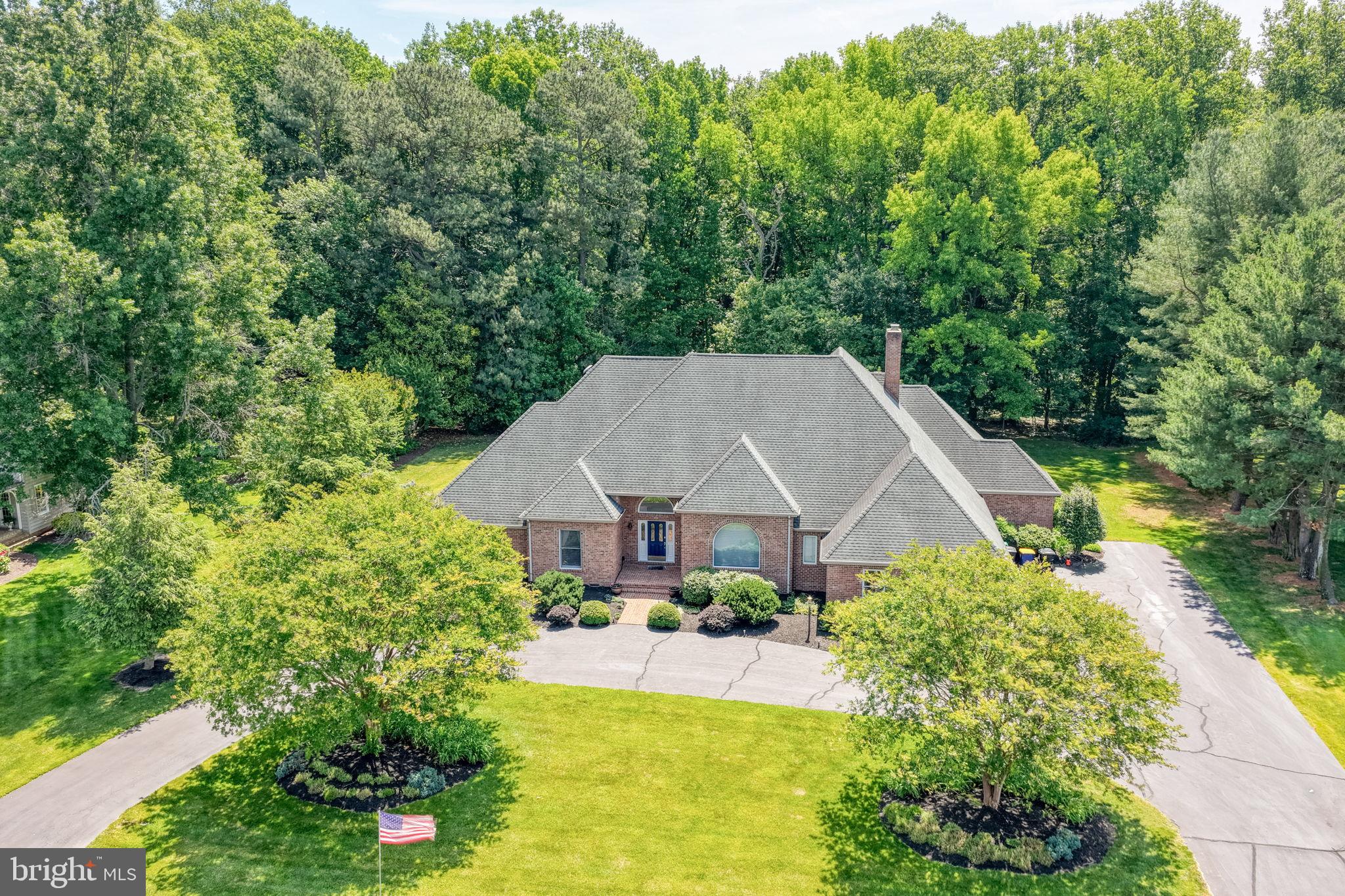 Nestled on a beautifully landscaped 1+ acre lot in the desirable Wild Quail community, this custom-built full brick exterior home offers timeless style and exceptional space. Featuring over 3,500 sq. ft., the open floor plan showcases soaring 12-foot ceilings, hardwood floors, crown molding, and two gas fireplaces. one double sided. The gourmet kitchen includes 42” cherry cabinetry, Corian countertops, a center island with prep sink, and a bright breakfast area opening to the family room. The spacious primary suite offers French doors to the deck, a fireplace, dual vanities, Jacuzzi tub, separate shower, and a large walk-in closet.  Additional highlights include a 33x9 screened porch, formal dining room, two-zone HVAC, 2 water heaters, partial basement, 3 car garage and circular driveway, oversized attic with expansion potential, and a new roof installed in 2011. Ideally located within walking distance to the Wild Quail clubhouse and pool, this remarkable property combines timeless craftsmanship, generous living space, and an unbeatable location–a must-see home on your next tour.