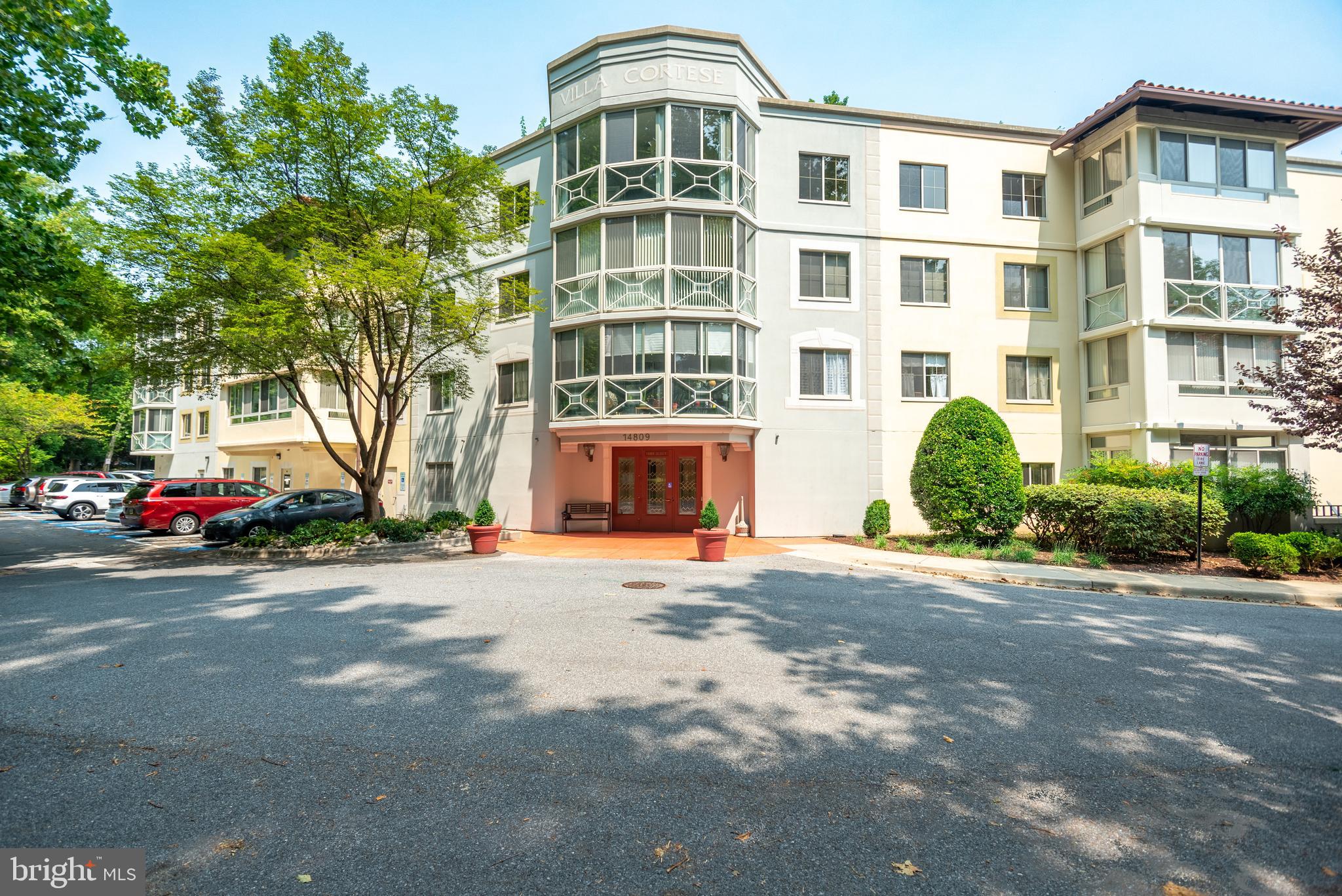 PRICE IMPROVEMENT on this Spacious and inviting condo in the sought-after Villa Cortese community! This charming home features a bright white kitchen with a pass-through and table space, a separate dining area, and a generous living room that opens to a sunroom with serene wooded views. The layout includes two bedrooms, each with its own bath, while the owner’s suite boasts a dressing area and multiple closets, including a walk-in. Ideally located near the main entrance, it's just a short walk to Clubhouse 1, restaurants, and a grocery store. Situated on the second floor of a low-rise, intimate building, this home offers comfort and convenience in a vibrant 55+ community.

 Enjoy incredible amenities, including two clubhouses, a golf course, tennis and pickleball courts, numerous clubs and activities, indoor and outdoor pools, a fitness center, and an on-site medical center. Public transportation is easily accessible, with a short ride to the Glenmont Metro and free on-property transportation to amenities and nearby shopping centers. Don’t miss this opportunity to embrace an active and engaging lifestyle!