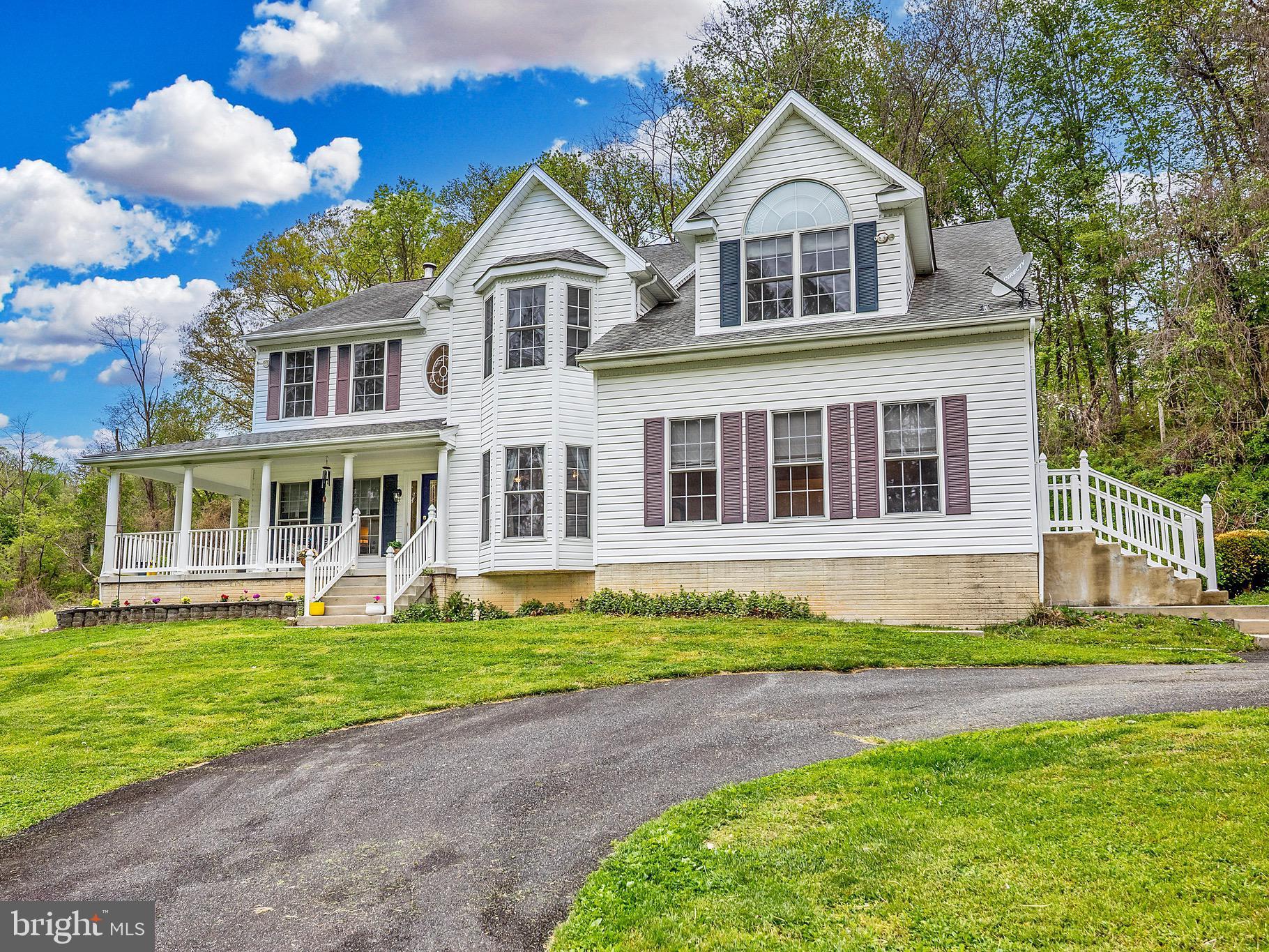 Situated on five private acres, this unique property offers an exceptional blend of significant scale, outdoor versatility, and outstanding value. The expansive grounds include a private pond complete with ducks, alongside ample space for those interested in gardening, chickens, or homesteading projects.
With over 6450 square feet of living space among 3 levels, this home is designed for both comfort and practicality. The main level includes an extra-large kitchen, sitting room, dining room, and a dedicated home office, complemented by two distinct living areas: a bright, sun-drenched room at the front of the home and a central family room anchored by a dramatic two-story stone fireplace.
The upper level is home to four bedrooms and two full bathrooms, highlighted by a notably large primary suite. This retreat features vaulted ceilings, a private sitting area, a walk-in closet, and a spacious ensuite bathroom. Additional living space is found in the finished lower level, which provides a recreation room, another full bath, and three separate storage areas.
Complementing the large-scale main home is a detached two-car garage plus a second substantial outbuilding. Though this flexible secondary building needs some modernizing, it represents a rare opportunity to create a rental unit, guest cottage, additional garage space, or a home-based business.
This property is ideal for a buyer seeking a private, expansive setting with the footprint, storage, and flexibility to support a variety of lifestyle and professional needs.