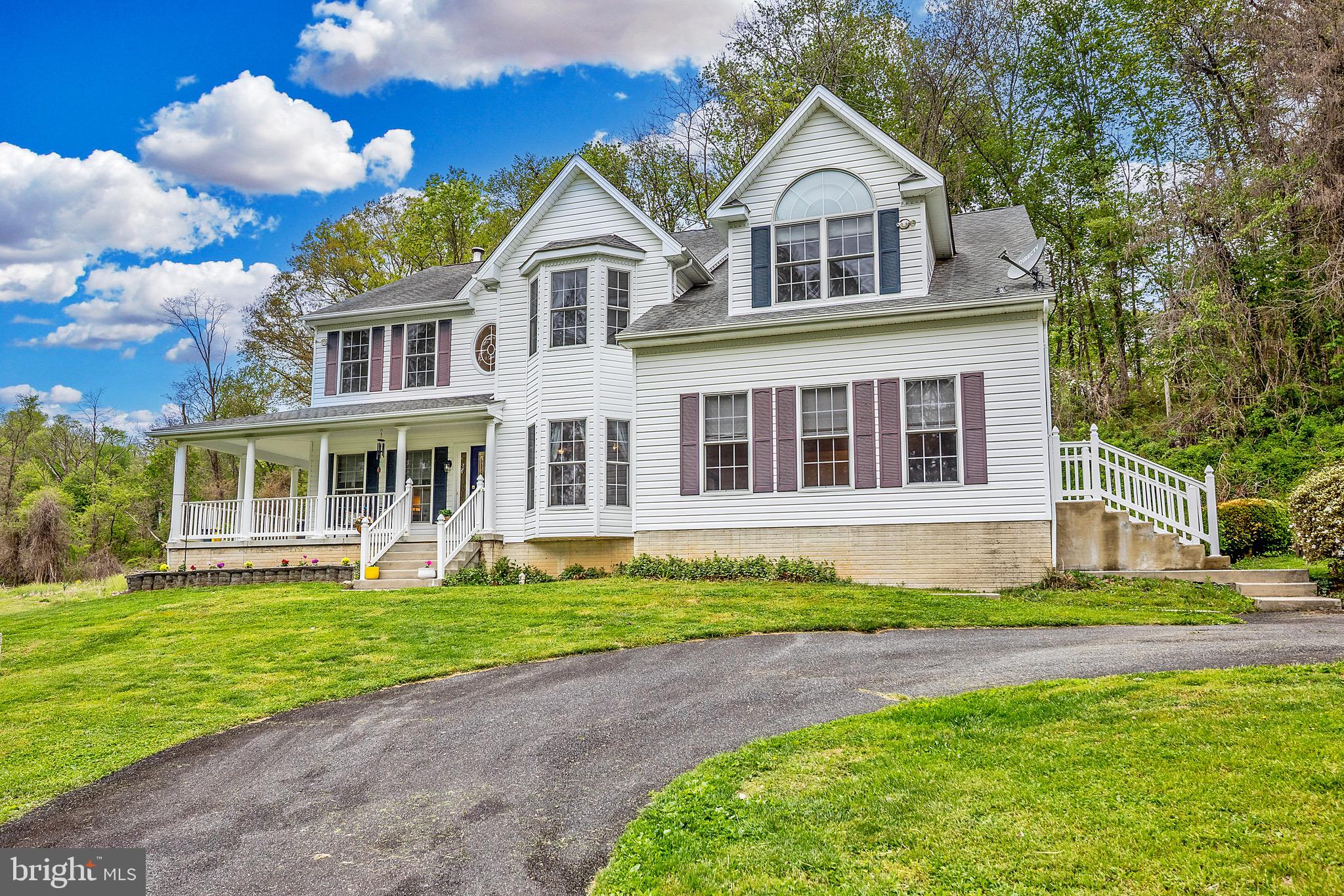 Situated on five private acres, this unique property offers an exceptional blend of significant scale, outdoor versatility, and outstanding value. The expansive grounds include a private pond complete with ducks, alongside ample space for those interested in gardening, chickens, or homesteading projects.
With over 6450 square feet of living space among 3 levels, this home is designed for both comfort and practicality. The main level includes an extra-large kitchen, sitting room, dining room, and a dedicated home office, complemented by two distinct living areas: a bright, sun-drenched room at the front of the home and a central family room anchored by a dramatic two-story stone fireplace.
The upper level is home to four bedrooms and two full bathrooms, highlighted by a notably large primary suite. This retreat features vaulted ceilings, a private sitting area, a walk-in closet, and a spacious ensuite bathroom. Additional living space is found in the finished lower level, which provides a recreation room, another full bath, and three separate storage areas.
Complementing the large-scale main home is a detached two-car garage plus a second substantial outbuilding. Though this flexible secondary building needs some modernizing, it represents a rare opportunity to create a rental unit, guest cottage, additional garage space, or a home-based business.
This property is ideal for a buyer seeking a private, expansive setting with the footprint, storage, and flexibility to support a variety of lifestyle and professional needs.