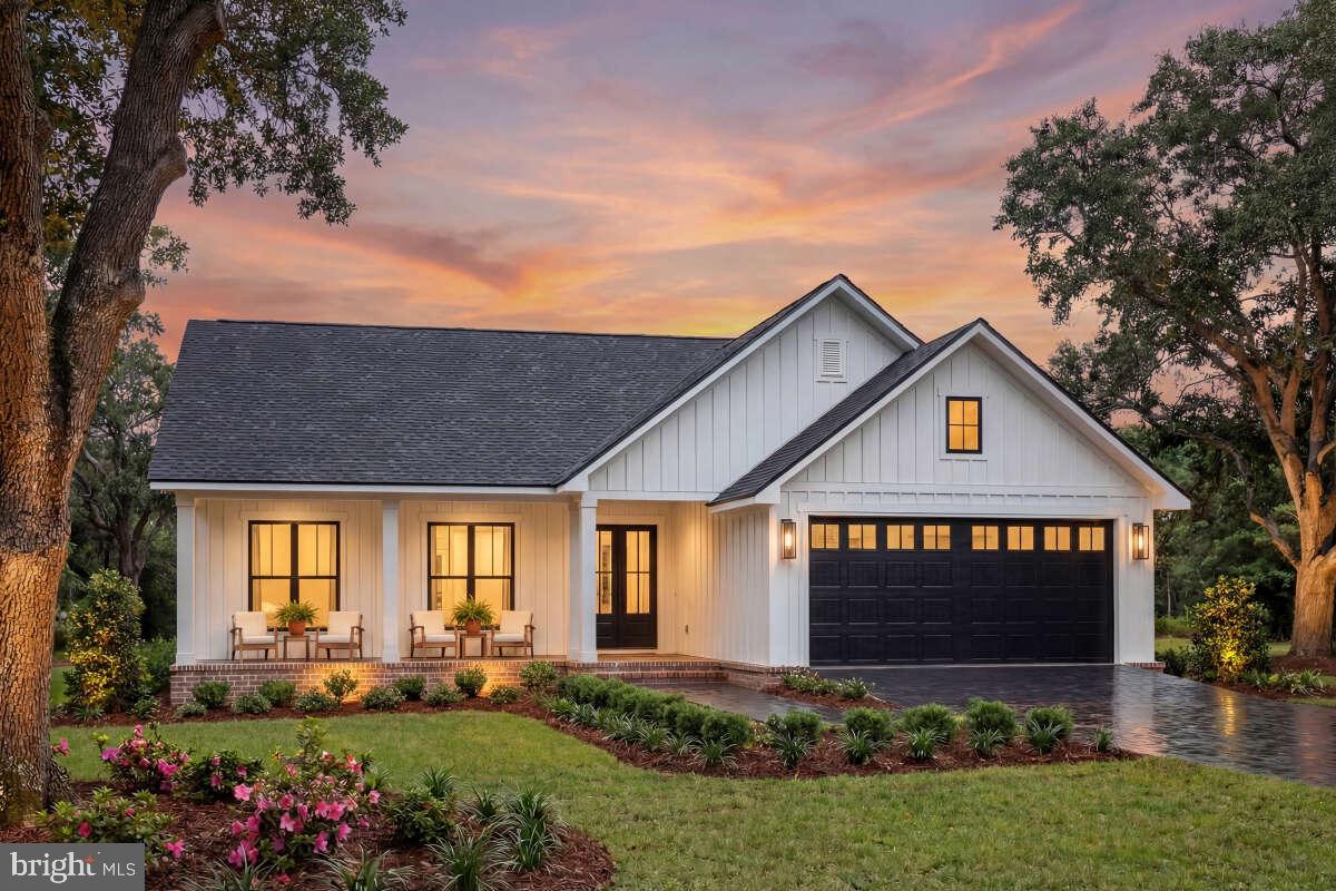 This inviting 1,532-square-foot ranch offers thoughtful design and genuine comfort in historic Onancock, Virginia located on a private 0.92-acre lot bordering a serene creek. With three bedrooms and two full bathrooms, the home features a smart layout that places the primary suite on one side for privacy, while the two additional bedrooms sit on the opposite end. At the heart of the home, you'll find an open floor plan where the kitchen, living, and dining areas flow together—perfect for everyday living and gathering with loved ones. Step outside to enjoy both a welcoming front porch and a private back porch, ideal for morning coffee or evening relaxation. The two-car garage adds convenience, while the home's single-level design makes everything easily accessible. Located in the charming, historic town of Onancock, within walking distance to Onancock's charming downtown area where you'll find shops, restaurants, and community events. The property is also near Chesapeake Bay for fun water activities and close to Riverside Shore Memorial Hospital. This property offers small-town character with thoughtful modern living space. Taxes are based on assessed value of land only. To be built & photos of the model home may include options.
