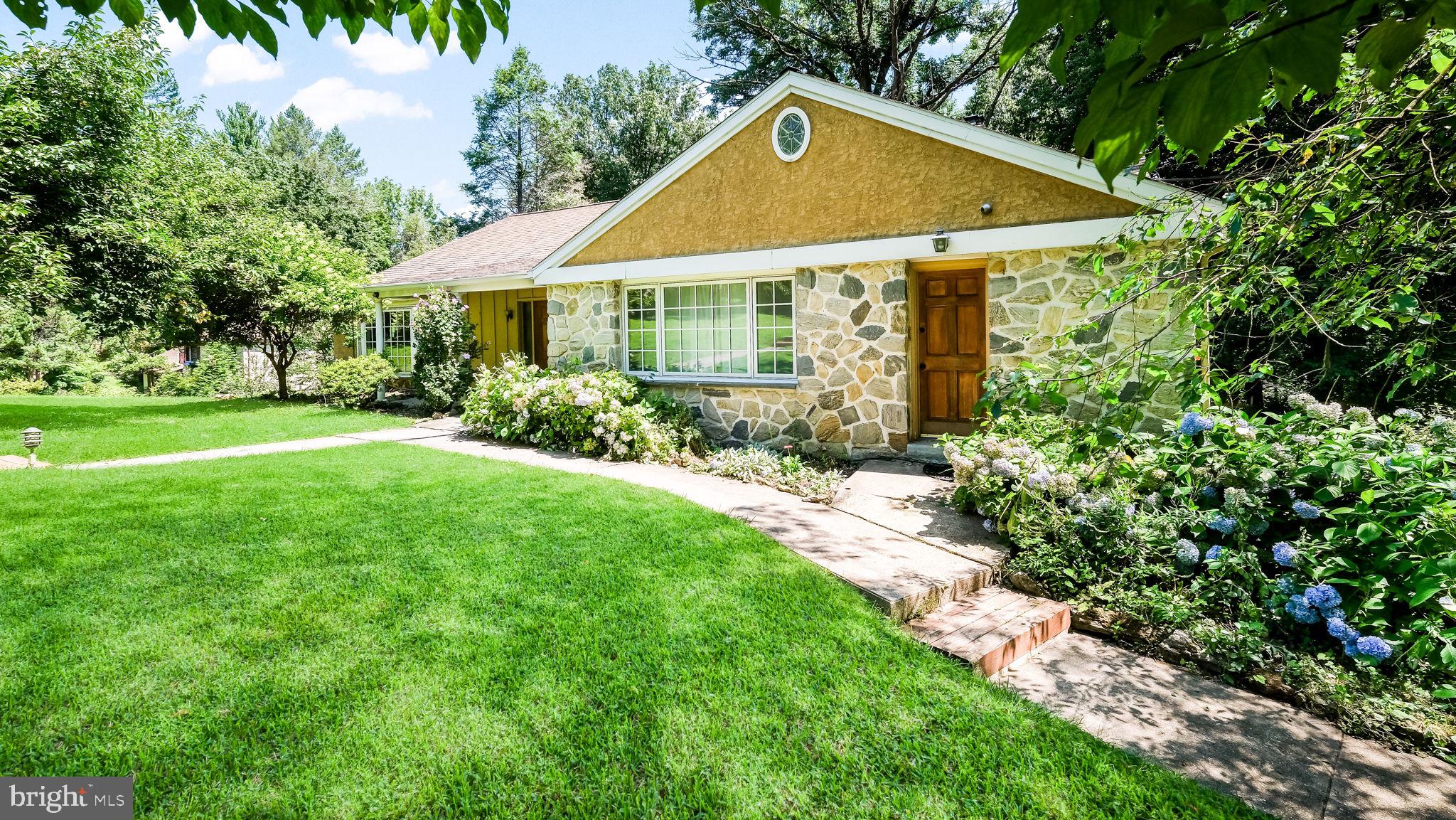 Welcome to this lovely and spacious three-level home situated on close to 2 acres in one of Lower Merion's most prestigious neighborhoods. This charming property features 6 bedrooms, 2 full bathrooms, and 1 powder room. The lower level features the 2-bedroom in-law or au pair suite with wall-to-wall carpeting, a full expanded modern bathroom with an accessible shower configuration, and a spacious den area with a wet bar and two brick wood-burning fireplaces. Doors from this level lead to the rear yard and patio, with rear stairs leading to a wood deck. This level offers excellent flexibility for multigenerational living and guest accommodations.

The main level features a spacious eat-in kitchen with a large breakfast nook, along with a formal dining room, spacious living room, and modern powder room. Beautiful hardwood flooring adds warmth and character to the main living areas. The kitchen and main level also provide access to the rear deck and stairs. A laundry area includes a washer, dryer, and second refrigerator, with an additional door providing access to the front yard.

The upper level features 4 bedrooms, a full modern bathroom, beautiful hardwood flooring, and ample closet space. The property also includes a small basement and an attached 2-car garage with direct access to the home. The garage offers abundant cabinet storage, a remote garage door, and an additional door leading to the basement. The long, spacious driveway provides parking for an additional 4-5 vehicles, with additional street parking available.

The expansive rear yard offers excellent potential for a pool, hot tub, or other outdoor amenities. A lovely lighted cement walkway leads from the main front entrance to the mailbox at street level. Ideally located near major roadways for an easy commute to Center City and surrounding areas. The Wynnewood Train Station is just minutes away, with convenient access to shopping, schools, supermarkets including Whole Foods, Giant, and Acme, numerous restaurants, drug stores, FedEx, car dealers, banks, religious institutions, and other amenities. Philadelphia International Airport is also conveniently located nearby.

A wonderful opportunity to own a spacious and versatile home in one of the Main Line's most sought-after locations.