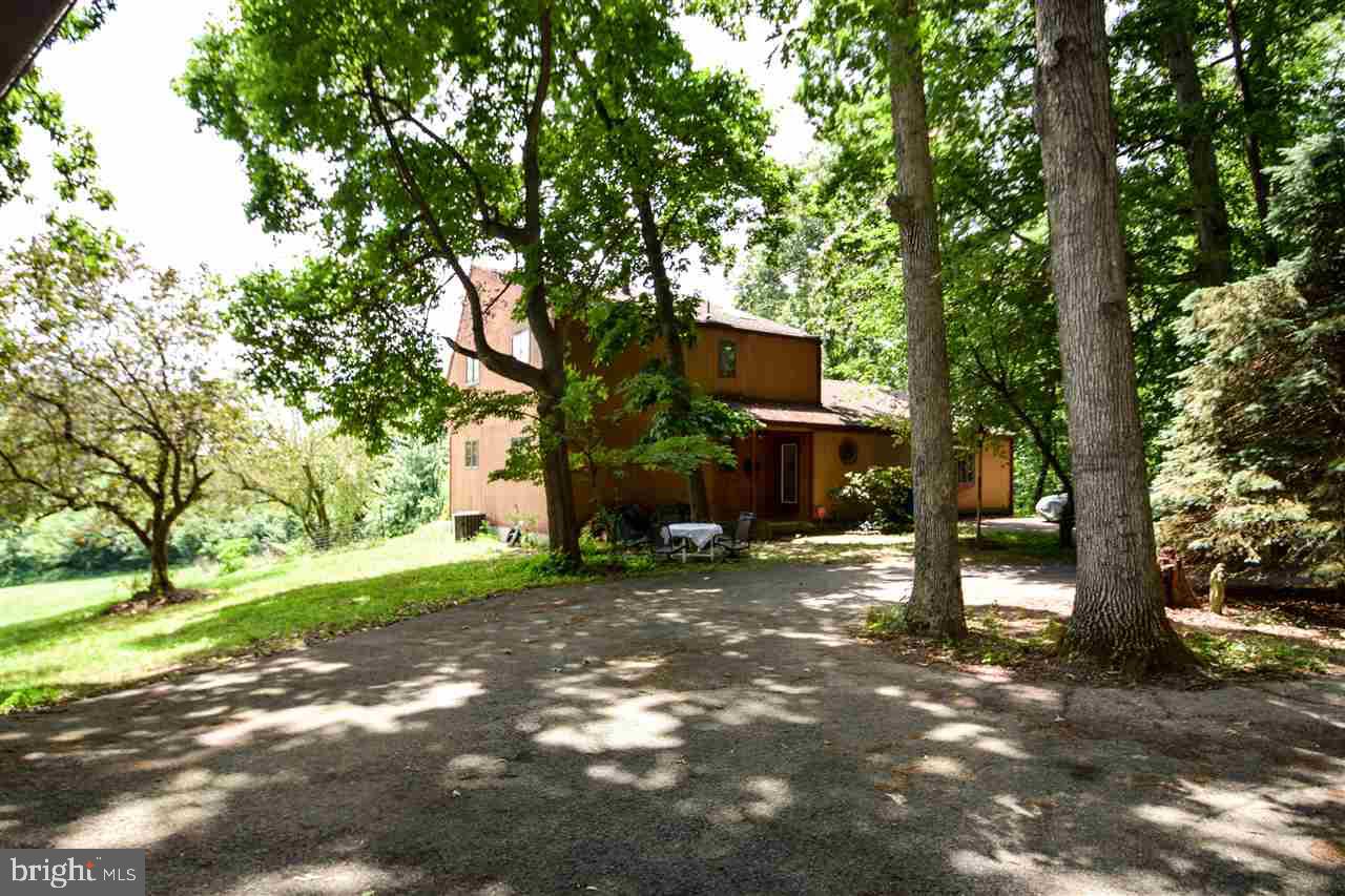 Great opportunity to create your own piece of paradise! Custom home on delightfully secluded 3.64 ac. lot has lots of potential, but needs your TLC to restore it to its original beauty.  Property includes 3BR, 1.5BA residence, detached 2-story 3-car garage & gorgeous, natural setting w/ lots of privacy, room to run & ample space for horses, chickens & other livestock too.
