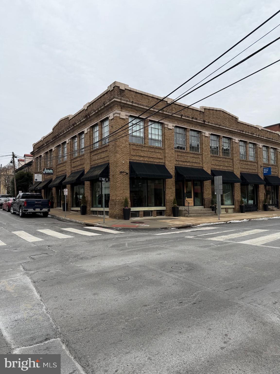 Welcome to the Bond Building — a rare investment opportunity in the heart of Newtown Borough.
This exceptional property offers a unique blend of open, flexible spaces, modern office layouts, dedicated showroom areas, soaring ceilings, and a sought-after industrial aesthetic.
Ideally located in the center of town—directly across from the State Store and the proposed Liberty Square redevelopment—this building is positioned for both immediate income and long-term appreciation.
The property features over 15,000 square feet of fully renovated, sprinklered space, along with on-site parking. It is currently configured into six office and showroom units and is fully leased, providing strong, stable cash flow. A new owner also has the opportunity to occupy one of the spaces if desired.
Approximate 7% cap rate, the Bond Building represents one of the premier commercial investment opportunities in Newtown.