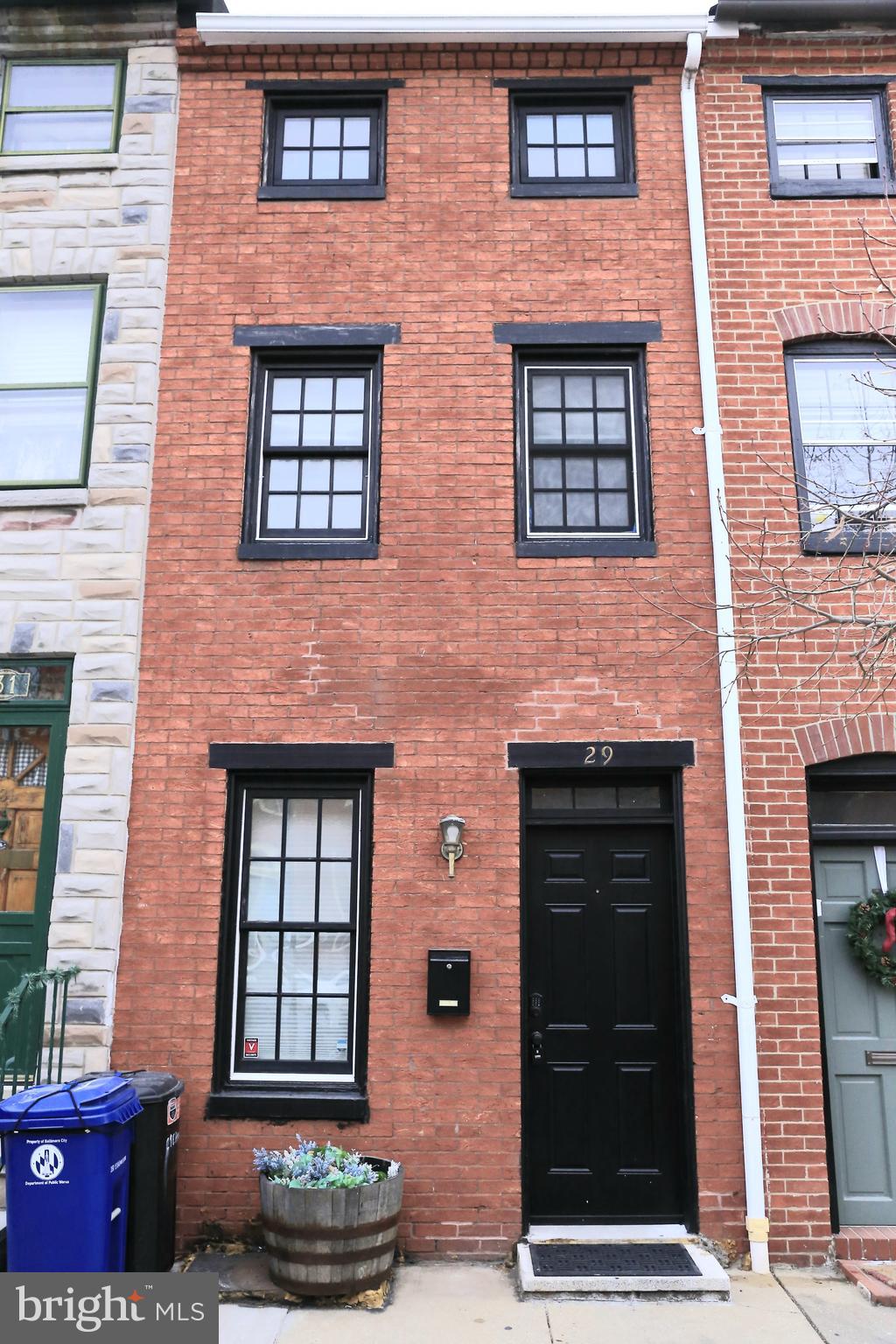 Welcome to this charming 3-story home located in the heart of Federal Hill, where classic charm meets modern convenience. This home features 2 spacious bedrooms and 1 well-appointed bathroom, perfect for comfortable city living. As you enter, you'll notice the refinished hardwood floors that run throughout the entire home, giving it a warm, inviting feel. Large windows and a skylight flood the space with natural light, creating an airy atmosphere with high ceilings that add to the home’s sense of openness. The partially finished basement offers additional storage space. This home is ideally located, just steps from retail shopping, local dining, and the vibrant Inner Harbor. Sports fans will appreciate the close proximity to both Ravens and Orioles stadiums, while commuters will love the quick access to all major highways. With a perfect blend of location, style, and modern upgrades, this home is truly a gem in Federal Hill.