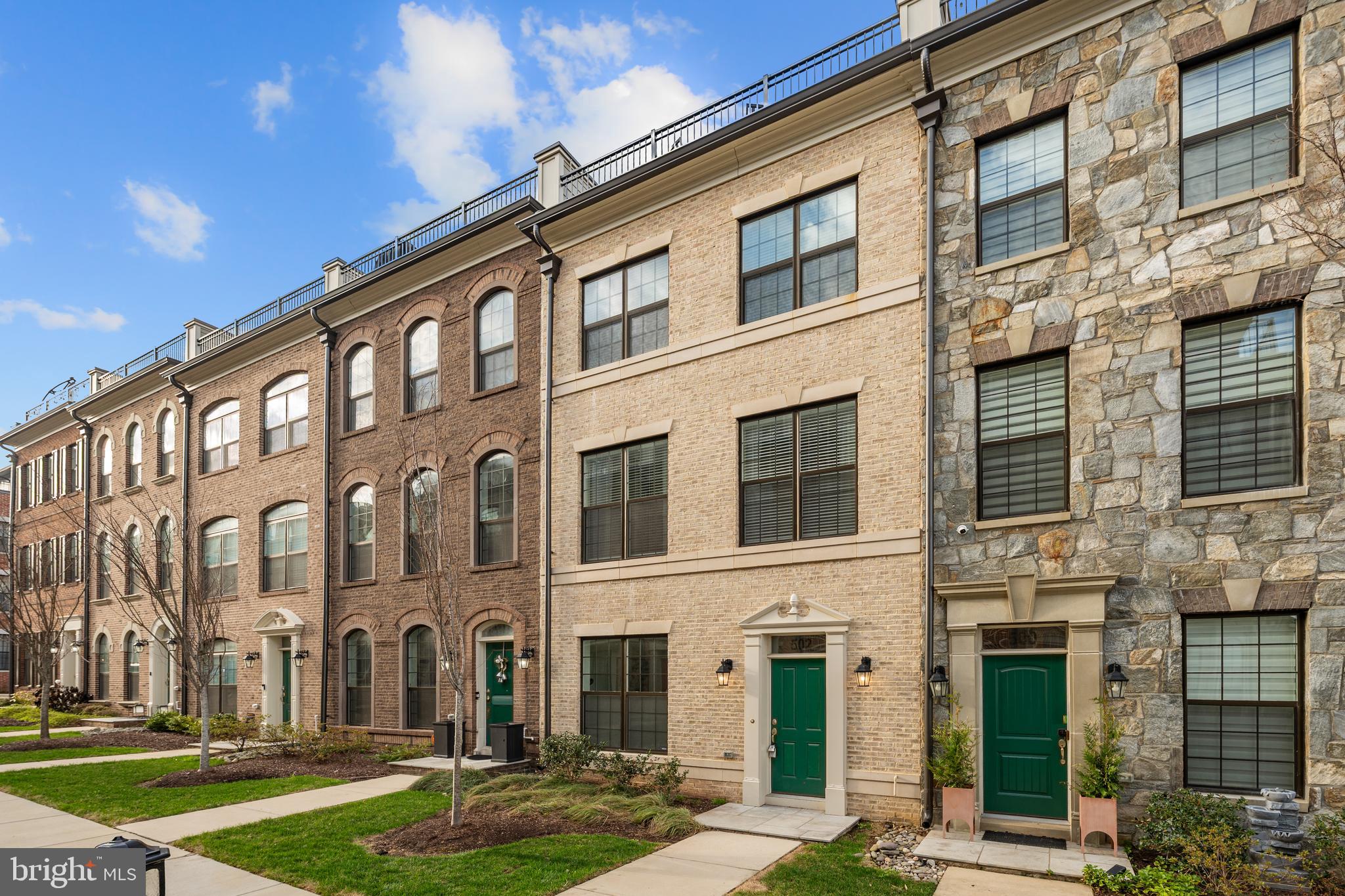 Welcome home to Potomac Overlook! This exceptional 4-level townhome offers sophisticated urban living with an impressive blend of luxury finishes and versatile living spaces in the heart of National Harbor, just two blocks to world-class dining, shopping and entertainment. Upstairs on the main level, you'll discover an open floor plan with modern recessed lighting and beautiful hardwood floors flowing seamlessly throughout the living room, gourmet kitchen and dining room, creating an ideal space for both everyday living and effortless entertaining. The heart of the home boasts a stunning kitchen with stainless steel appliances including a wall oven and upgraded dishwasher, gleaming granite countertops, custom backsplash and under cabinet lighting, all anchored by an oversized island breakfast bar perfect for casual dining and conversation. Through elegant barn doors off the dining room, a dedicated office provides a quiet retreat with built-in cabinetry and shelving for all your work-from-home needs. Upstairs, hardwood flooring continues to the bedroom level, where the generously sized primary suite offers an abundance of storage with built-in cabinets and a walk-in closet featuring a custom closet system, complemented by a luxurious en suite bathroom with a wide double sink vanity and step-in shower with built-in seat. The second bedroom includes its own walk-in closet and access to a second full bathroom in the hall, while an upgraded washer and dryer in the bedroom level laundry room add everyday convenience. The top level presents a versatile recreation room, third bedroom and full bathroom, ideal for guests or in-laws and enhanced by a wet bar and dramatic double-sided fireplace that flows to the crowning jewel of this home - a private rooftop terrace offering an extraordinary outdoor living experience and beautiful views. Downstairs on the entry level, the bonus room with full bathroom provides additional space for a home gym, den or playroom, while the 2-car garage and driveway offer both abundant storage and parking. A fourth entry-level bedroom could easily be created  with the addition of a wall. With the vibrant waterfront promenade, MGM National Harbor, Tanger Outlets and countless restaurants just a few blocks away, this remarkable home delivers an unparalleled lifestyle in one of the region's most sought-after locations. Schedule a private tour of your beautiful new home today and make 2026 the best year ever!