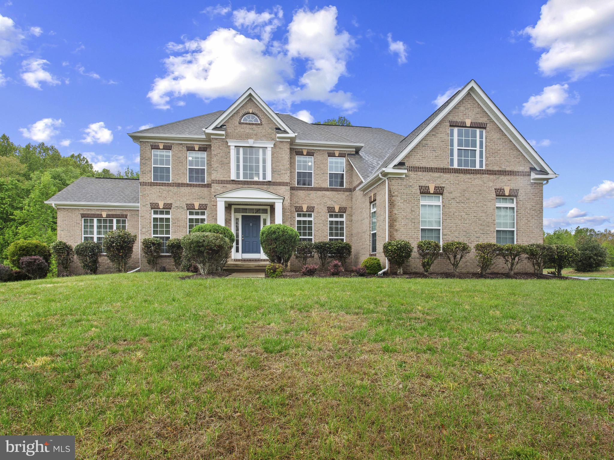 HIGHLY MOTIVATED SELLER!!! Discover the perfect blend of elegance and comfort in this stunning Colonial-style home nestled in the desirable Piscataway Heights community. With 5 spacious bedrooms and 4.5 bathrooms, this residence offers an impressive 3,334 square feet of thoughtfully designed living space on the main two living levels, ideal for both relaxation and entertaining. Step inside to find a warm and inviting atmosphere, accentuated by beautiful hardwood floors and plush carpeting throughout. The open floor plan seamlessly connects the family room, complete with a cozy fireplace featuring glass doors, to the gourmet kitchen. This culinary haven boasts upgraded countertops, an island for casual dining, and a breakfast area that invites morning sunlight. The formal dining room, adorned with chair railings, sets the stage for memorable gatherings. The sunroom boasts natural light and an extra cozy area that could be used as an extra gathering area. Retreat to the luxurious master suite, where a walk-in closet and a spa-like bathroom with a soaking tub and stall shower create a private oasis. Each additional bedroom is generously sized, ensuring comfort for everyone. The fully finished basement, with a walkout level and ample natural light, offers endless possibilities-whether it's a game room, home gym, or guest suite. Outside, the property spans over 2 acres, providing a serene backdrop that backs to lush trees. The meticulously landscaped yard is perfect for outdoor activities or simply enjoying nature's beauty. With a side-entry 3 car garage and a concrete driveway, parking is a breeze. This home is not just about aesthetics; it's equipped with essential features that enhance daily living. Enjoy the convenience of upper-floor laundry hookups, a pantry for all your storage needs, and recessed lighting that adds a modern touch. Recent UPDATES!!!! HVAC 2023, Deck 2024, Windows (12) 2026, Garage Door (2026), Basement Carpet 2026, Repaved Driveway 2026, New Kitchen cabinets 2026.  This property is more than just a house; it's a place where memories are made, and dreams are realized. Don't miss the opportunity to make this exquisite home your own! Schedule a showing today and experience the charm and sophistication that awaits you in Piscataway Heights.