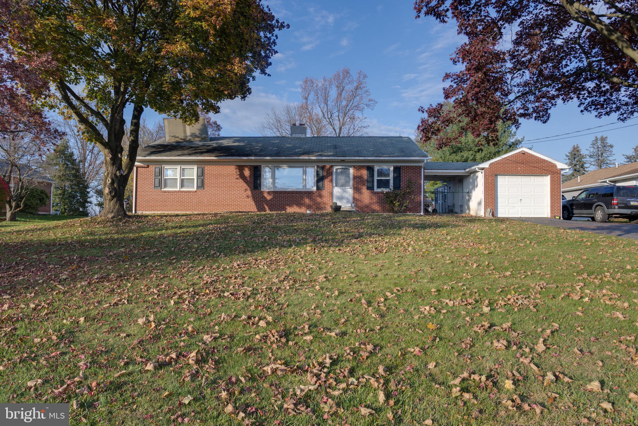 Welcome to 407 East Moyer Road! This lovely ranch style home is situated on 1.4 acre lot in Boyertown Schools. As you enter the front door you are greeted by a large living room area with hardwood floors with a center fire place complete with a brand new pellet stove insert. As you move through you will find a formal dining area with hardwoods and a recently updated kitchen with quartz counter tops and stainless steel appliances! On the other side of the home you will find three spacious bedrooms and a full-size bathroom with a double vanity. Outside there is a perfect patio to enjoy the full view of the back yard. There also is a covered breezeway leading to a one car garage. There is a huge open basement with a cedar closet just waiting to be finished!! Schedule your private tour today!