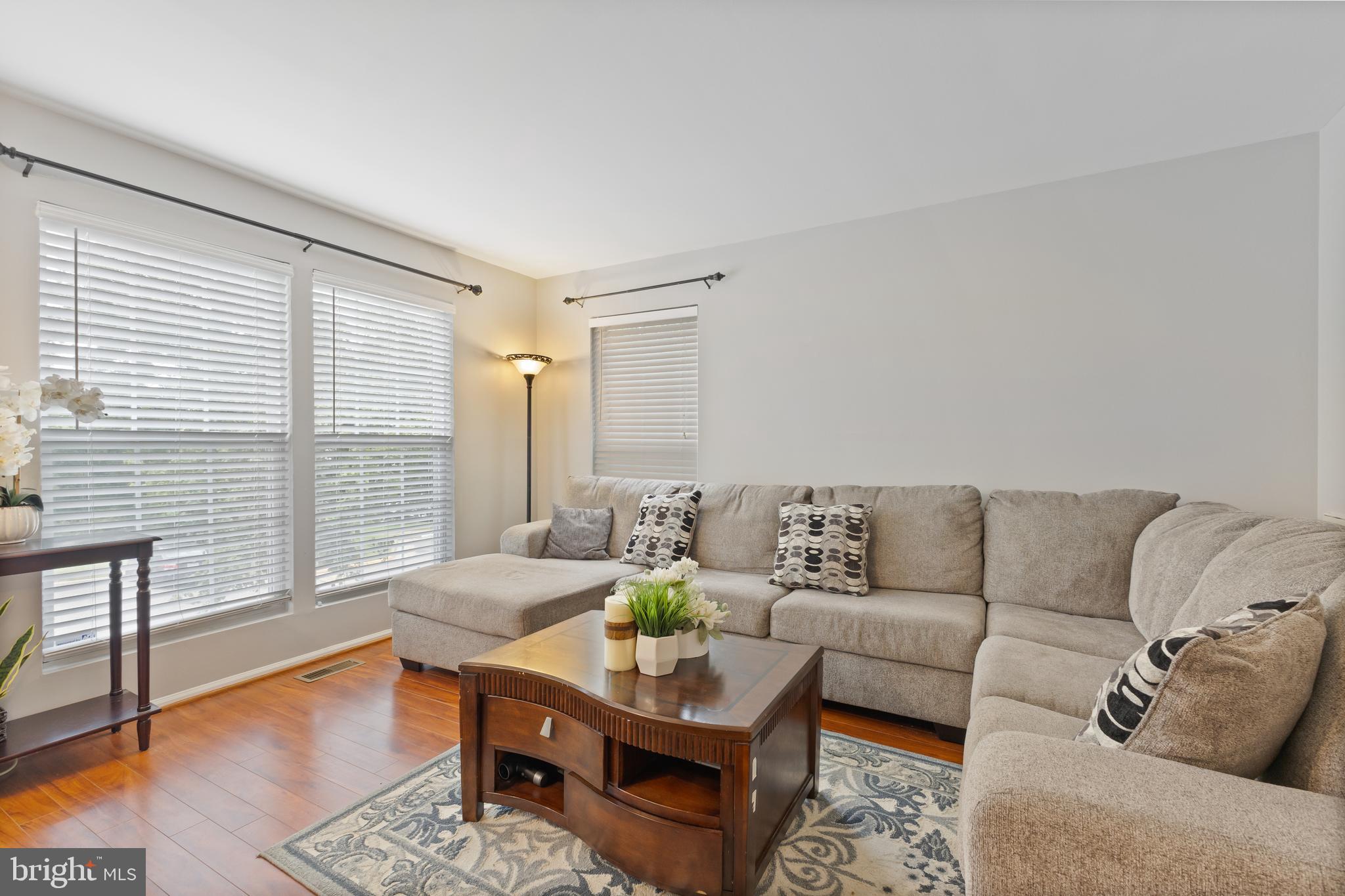 Welcome to this Charming End-Unit Townhome, move-in ready in the Coveted  Heather Glen Community in Woodbridge! This beautifully updated home features 3 bedrooms and 2.5 bathrooms, offering a harmonious blend of elegance and comfort across its 1,988 square feet.

Step inside to be greeted by an abundance of natural light, freshly painted, and modern finishes, all contributing to the home's clean, modern look. The main level a spacious living  room that boasts gleaming hardwood floors exuding warmth and sophistication. The large eat-in kitchen features  brand-new stainless steel appliances that is perfect for fine dining and entertaining within your home. 

The generously sized primary bedroom is a true retreat, featuring a walk-in closet and an ensuite bathroom, complemented by two additional bedrooms and another full bath. The fully finished basement, with recessed lighting, offers a private space ideal for an office or relaxation, and houses a convenient laundry/storage room.

Outdoor enthusiasts will appreciate the Huge deck in  backyard, complete with a spacious patio perfect for relaxation and entertaining. Enjoy serene open views and the comfort of air conditioning, while the cozy fireplace adds a touch of warmth during cooler evenings.

The home  includes two reserved parking spaces and is located near Potomac Town Center, Potomac Mills, other shops and fine dining. Just minutes from bus stops and commuter parking, it offers the perfect blend of tranquil living and city convenience.