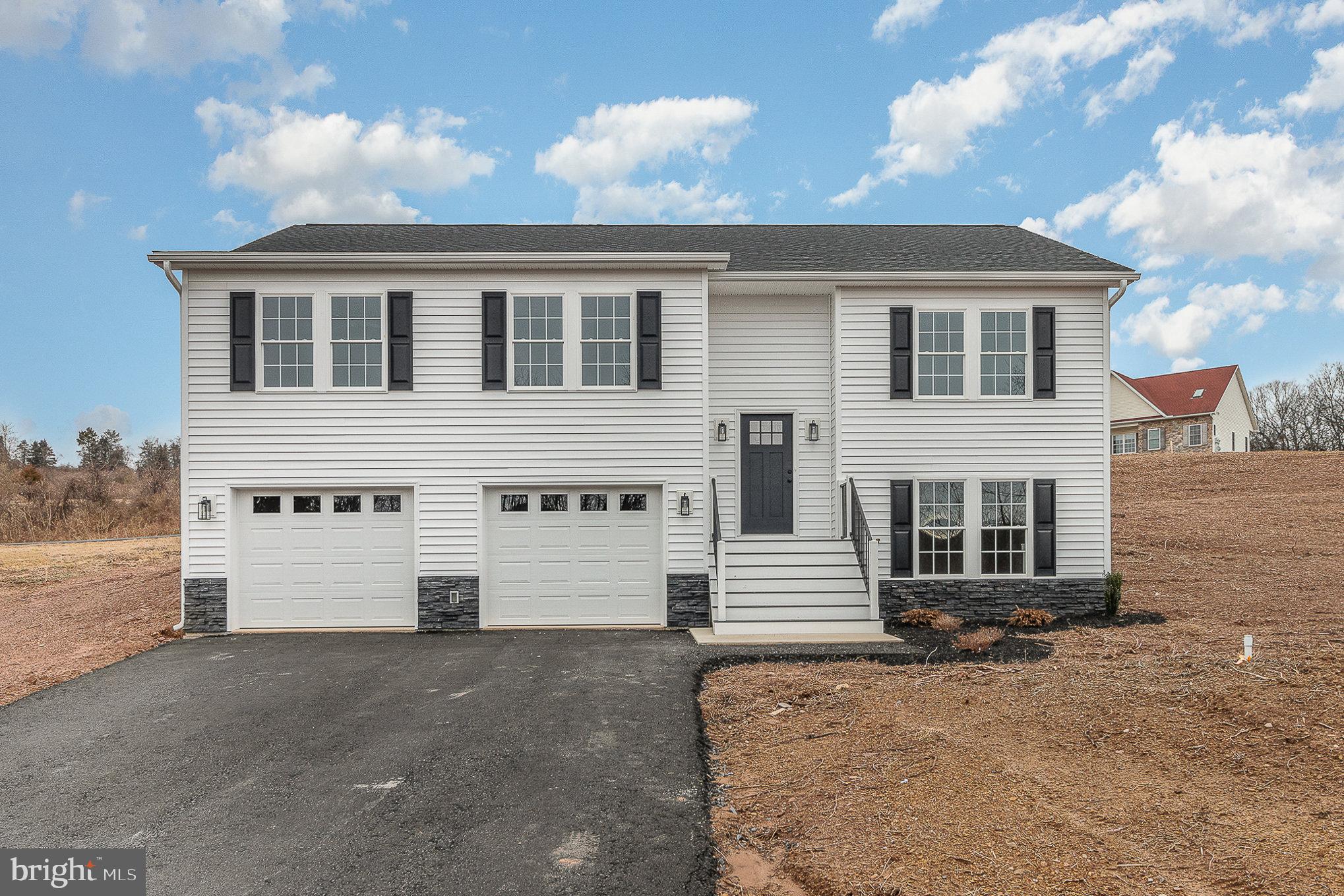 Nestled on a sprawling 3.28-acre lot, this BRAND NEW bilevel home offers the perfect blend of comfort and space, inviting you to experience the joy of country living. As you step inside, you'll be greeted by an open floor plan that seamlessly connects the living room, dining area, and kitchen, creating a warm and inviting atmosphere.

The living room features a cozy electric fireplace, providing a focal point for relaxation and gatherings. With cathedral ceilings overhead, the space feels expansive and filled with natural light, making it an ideal spot for both everyday living and entertaining.

The well-appointed kitchen boasts solid surface countertops, a convenient pantry, and modern stainless steel appliances, making meal preparation a breeze. Whether you're a culinary enthusiast or simply enjoy a well-designed kitchen, this space has you covered.

The main floor hosts three bedrooms, including a gracious primary suite complete with a full bath, offering a private haven for rest and rejuvenation. The lower level adds versatility to the home, featuring a comfortable family room and an additional fourth bedroom suite with a private bathroom.

Practicality meets convenience in the 24x32 garage, providing ample space for up to four small cars or creating an expansive workroom area for various projects. Whether you're a car enthusiast or need a workshop for hobbies, this garage is ready to accommodate your needs.

Outside, the vast 3.28-acre property offers opportunities for outdoor activities, gardening, or simply enjoying the serenity of nature.

Don't miss the chance to make this bilevel beauty your home – a harmonious blend of modern comforts and peaceful surroundings await you! Contact us today to schedule a viewing and experience the charm of this exceptional property.