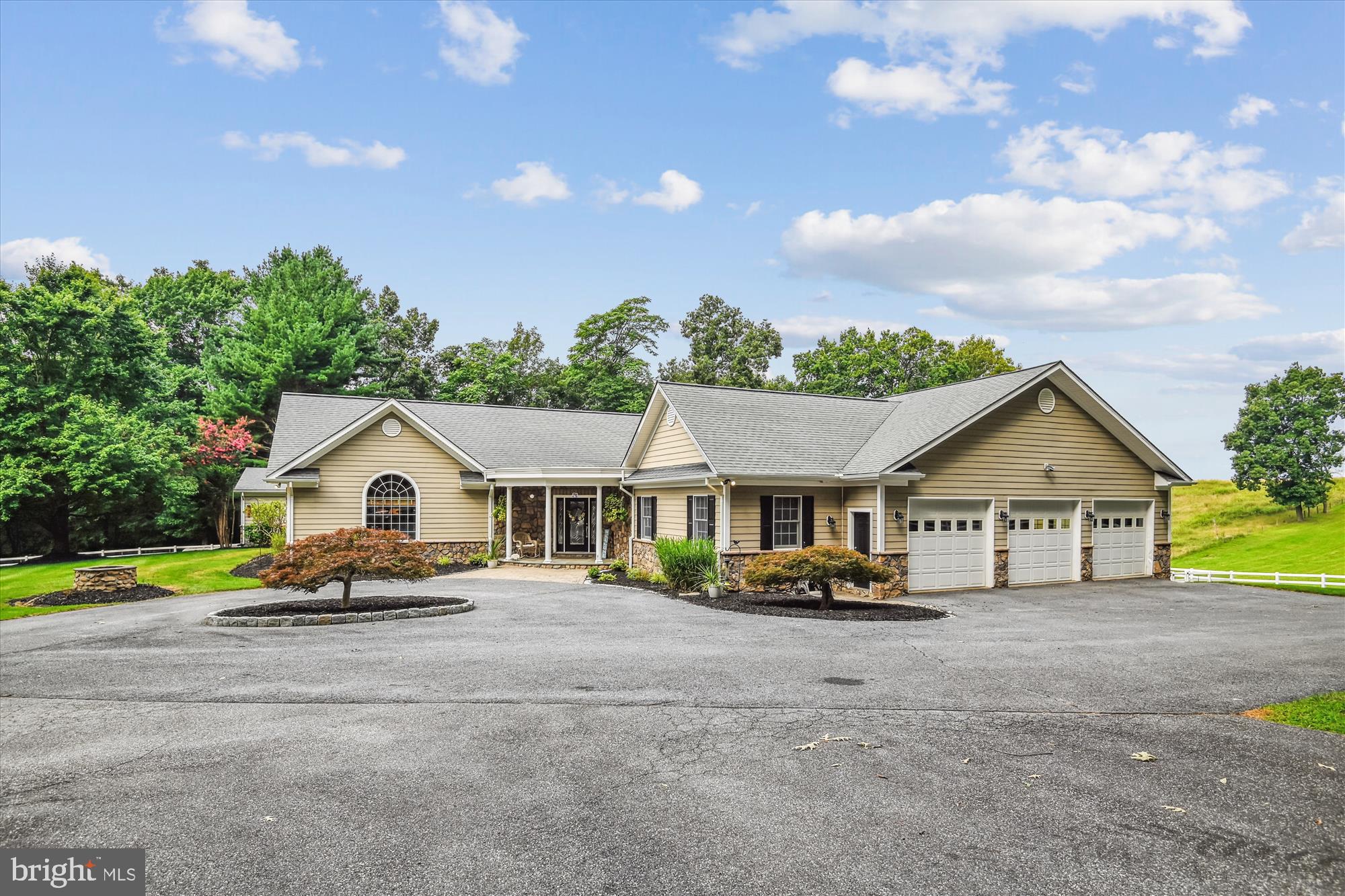Welcome to 4162 Bill Moxley Road.  This completely custom meticulously maintained  home sits on nearly 7.5 acres with a pool and barn perfect for horses.  The home has 5 bedrooms and 6 bathrooms.  As you enter the front doors you come into the heart of the home, a large family room with high ceilings and hardwood floors.  The family room opens up to the kitchen and a sitting room space with a beautiful stone fireplace.  The kitchen is updated with stainless steel appliances including a commercial grade stove and refrigerator.  The breakfast nook and large pantry are off the kitchen, as well as a Trex deck overlooking the pool.  The primary suite has its own wing of the house with sitting area space and private access to the back deck.  The primary bathroom has a separate oversized shower and jetted tub, tons of mirrors and leads into a huge fully custom closet.  The opposite side of the home has 3 large bedrooms, all with large custom closets and two full bathrooms.  As you head downstairs you pass the billiards rooms, with built in bar, high ceilings and tons of windows letting in natural light.  The basement has a large open space, perfect for a second family room that incudes a second bar, a wood stove and access to the backyard.  There are 2 more large closets and an additional full bathroom in the main basement.  A second basement garage leads to an in-law suite, with 2 bedrooms, one bathroom, living room and full kitchen.  The in-law kitchen has granite countertops, a large island and access to the backyard.  This is an in-laws dream! House includes a Generac whole house generator. Barn has 2 stalls, electric and water.  Conveniently located minutes from Mt. Airy and New Market.  Don't miss out on this rare find!  Schedule a showing today!!