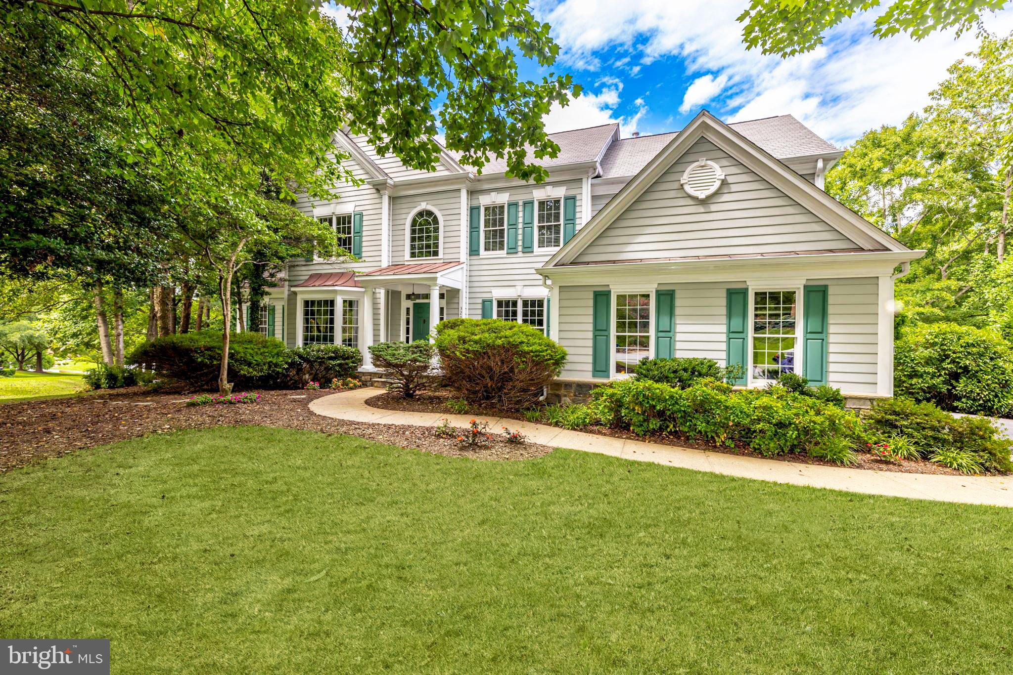 Spacious colonial on a private and treed setting in sought after Wheatland Farms. Providing a light-filled and versatile layout with new light fixtures and paint throughout, the main level offers a living room, dining room and kitchen that features a large center island, a walk-in pantry and a breakfast area that opens to the family room with two-story ceilings, a fireplace and access to the backyard deck. A great room, a study with built-ins, a laundry room, a powder room and an attached two-car garage complete this level. Upstairs, the expansive primary suite offers a gas fireplace, a large walk-in closet and a primary bath. There is a second bedroom suite and two additional bedrooms that share a jack-and-jill bath. The walkout lower level features a large recreation room with a fireplace and wet bar. There is also a fifth bedroom, an office, a bonus room, a full bath and a utility room. The backyard offers a large deck with stairs, a stone patio and a sweeping  lawn. Close to both I-66 and Chain Bridge Road, Metro and all the shops and dining of Vienna are only a quick drive away.