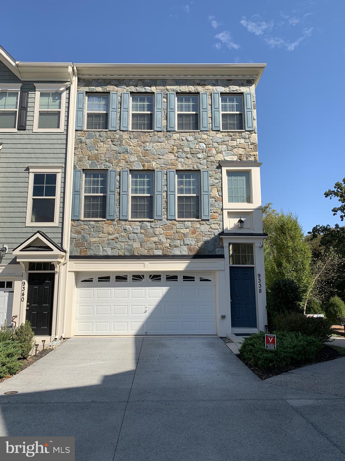 This light, bright and spacious 3BR, 2 full and 2 half bath, stone front townhome with attached 2 car garage is a must see!  This like-new home features engineered hardwood floors, oversized windows, 9'+ ceilings, cathedral ceilings, recessed lighting, ceiling fans and more!  An open floor plan on the main level perfectly blends the living, dining and kitchen areas and includes excellent cabinet space, granite counters, stainless steel appliances, pantry and half bath.  The upper level boasts cathedral ceilings through out and features a master bedroom suite with walk-in closet and super master bath, plus two additional bedrooms, hall laundry closet and full hall bath.  The finished walk-out lower level includes a rec room/office with 9'+ ceilings, gas fireplace, stone hearth and mantel and half bath.