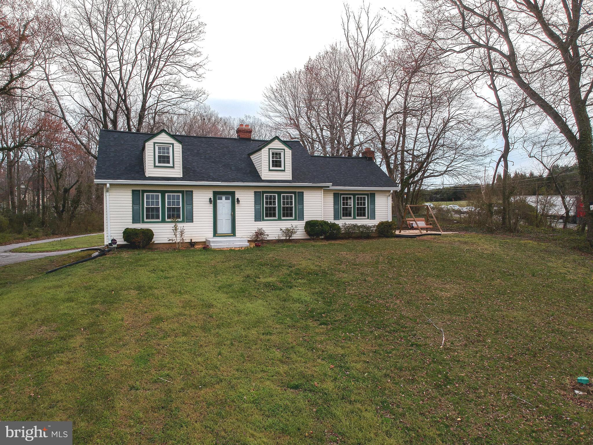 Charming Cape Cod offering 3 bedrooms, 2 full baths, and 1,902± square feet of living space, all situated on a 1-acre lot. The property features a spacious, partially fenced backyard, a storage shed, and convenient access for commuting in any direction. The main level includes an eat-in kitchen with solid oak cabinetry, an oversized recreation room with a cozy propane fireplace, a welcoming living room with an electric fireplace, one bedroom, one full bath, and a laundry room. Upstairs, you'll find two additional bedrooms, a comfortable sitting area, a full bath, and ample storage space. Recent improvements include a new roof installed within the last year. For those seeking additional living space, the unfinished basement offers the opportunity to relocate the laundry area to its original location, creating the potential for a fourth bedroom on the main level. Whether you're looking for room to grow, space to entertain, or the charm of country living with easy access to nearby destinations, this home is ready to become your dream home.