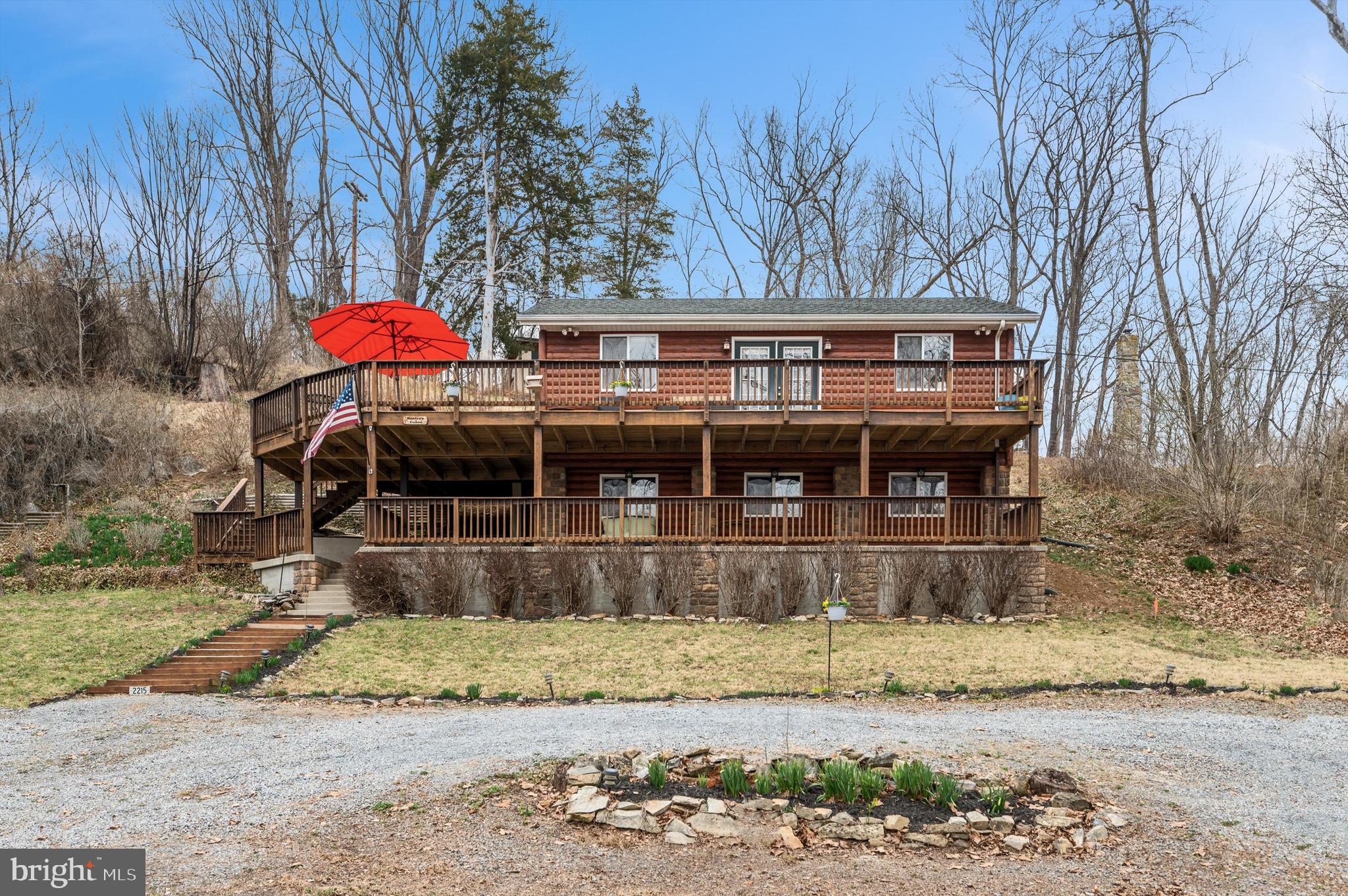 Welcome to 2215 Lockes Mill Road, a stunning log-sided home offering breathtaking views and
direct access to the Shenandoah River. Nestled near historic Lockes Mill, Watermelon Park, and a
public boat landing, this property is perfect for weekend getaways, year-round living, or a prime
investment opportunity as a short-term rental. Situated on a .43-acre lot with 64 feet of private
river frontage, this beautifully remodeled home combines rustic charm with modern comforts. The
inviting living room features a striking stone wall and a fireplace with a wood-stove insert,
circulating fan, and Forever Flex chimney lining, creating a warm and cozy atmosphere. The
home boasts two levels of extensive decking, providing the perfect space for entertaining or
simply enjoying the tranquil river views. Inside, the home showcases royal mahogany laminate
and tile flooring, wood doors, and custom trim throughout. The kitchen is elegantly designed with
tile walls and a backsplash, while a circular staircase adds character and charm. The spacious
bathroom includes a 6x6 tiled shower, offering a spa-like experience. This home is equipped for
all seasons with two Carrier wall units providing efficient heating and air conditioning, as well as
baseboard electric heat on the lower level. A fully floored attic provides additional storage space,
and a well house at the top of the lot doubles as a storage shed. This riverfront property offers
endless possibilities. Whether you're looking for a serene primary residence, a weekend escape,
or a high-demand Airbnb, this home delivers a rare opportunity to own a piece of waterfront
paradise.