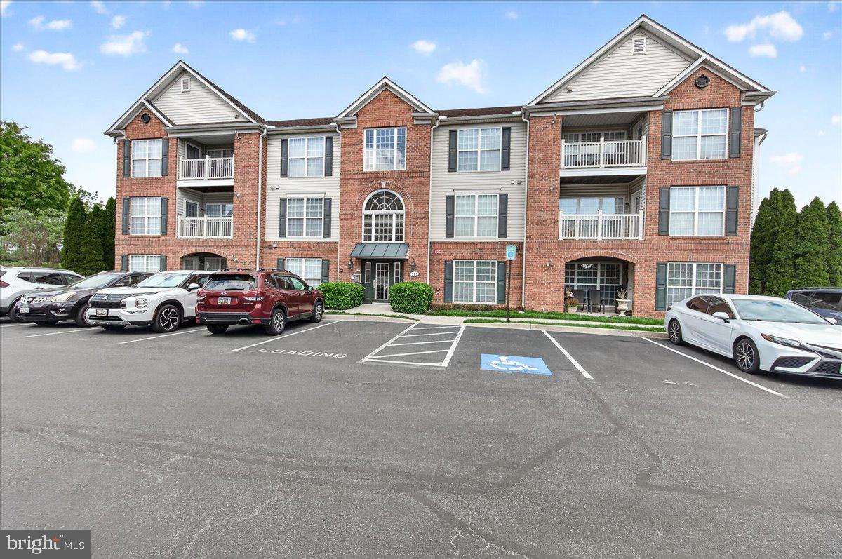 Investor Opportunity!   Welcome to 595 Cawley Drive, Unit #4-3C!  This meticulously maintained 2-bedroom, 2-bath condo offers spacious, low-maintenance living in a desirable elevator building on the top (4th) floor — with no one above you.  Inside, you’ll find beautiful hardwood flooring throughout, complemented by vaulted ceilings in the living and dining areas and large windows that fill the space with natural light. The kitchen features maple cabinetry, electric cooking, and a full appliance suite including stove, refrigerator, microwave, along with a built-in pantry and space for a cozy breakfast table.  
The primary suite provides a peaceful retreat with vaulted ceilings, a ceiling fan, two closets, and a private en-suite bath complete with a walk-in shower and tile flooring. A well-sized second bedroom with ceiling fan sits conveniently near the second full bath. A storage/utility closet and in-unit washer and dryer add everyday convenience.
Investment Highlights:   Tenant in place through the End of May 2027,  Current rent: $1,785/month which includes water/sewer, HOA &  Condo Fees, and management fee.  Long-term tenant (8 years) who would like to stay with reliable occupancy and immediate cash flow.  This is a turnkey investment offering comfort, convenience, and steady income in a prime location.