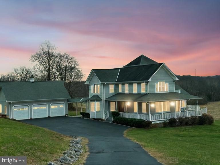 NEW PRICE! You won't be disappointed in this spectacular home on 39+ acres (the majority in crops).  Amazing 360 view within this light filled home with view of Sugarloaf Mountain.  Very private and less than 10 minutes from I-270.  You will fall in love with the wrap around porch...there is a covered walkway to your 3 car garage.  There is a formal living room ,wide open floor plan, gourmet kitchen, sunlit family room with a propane stove.....Entertain in the formal dining room with view.  On the main level there are 2 bedrooms and large full bath with a walk in shower.  Amazing upper level primary suite with 2 large unbelievable walk in closets  and private bath with heated floors, plus 3 additional bedrooms, full hall bath and convenient upper level laundry.  There is a 3 rd level loft with beautiful views and storage space.  The finished lower level has full windows,  space for additional rooms, half bath and additional laundry and storage.  Double doors open to walk outside.  The home has a screened porch and upper level balcony.  It has a heavenly, and welcoming feel....don't miss out on this private estate.  Seller prefers Legacy House Title.