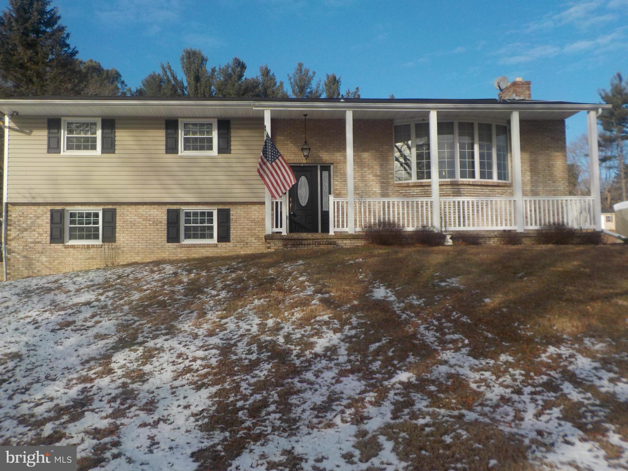 Beautiful Split Foyer sitting on over 1.10 acres w/3 BR & 2.5 BA. Hardwood floors in every room. Breakfast Room, Kitchen, separate Dining Room, large Living Room, Master Bath w/Shower, slate Foyer, huge Family Room w/built in cabinets and a brick wood burning fireplace, 17 x 16 Sun-Room, Trek deck, large 2 car Garage (25 x 23) w/additional Spare Room. Home Warranty. Convenient to major highways.